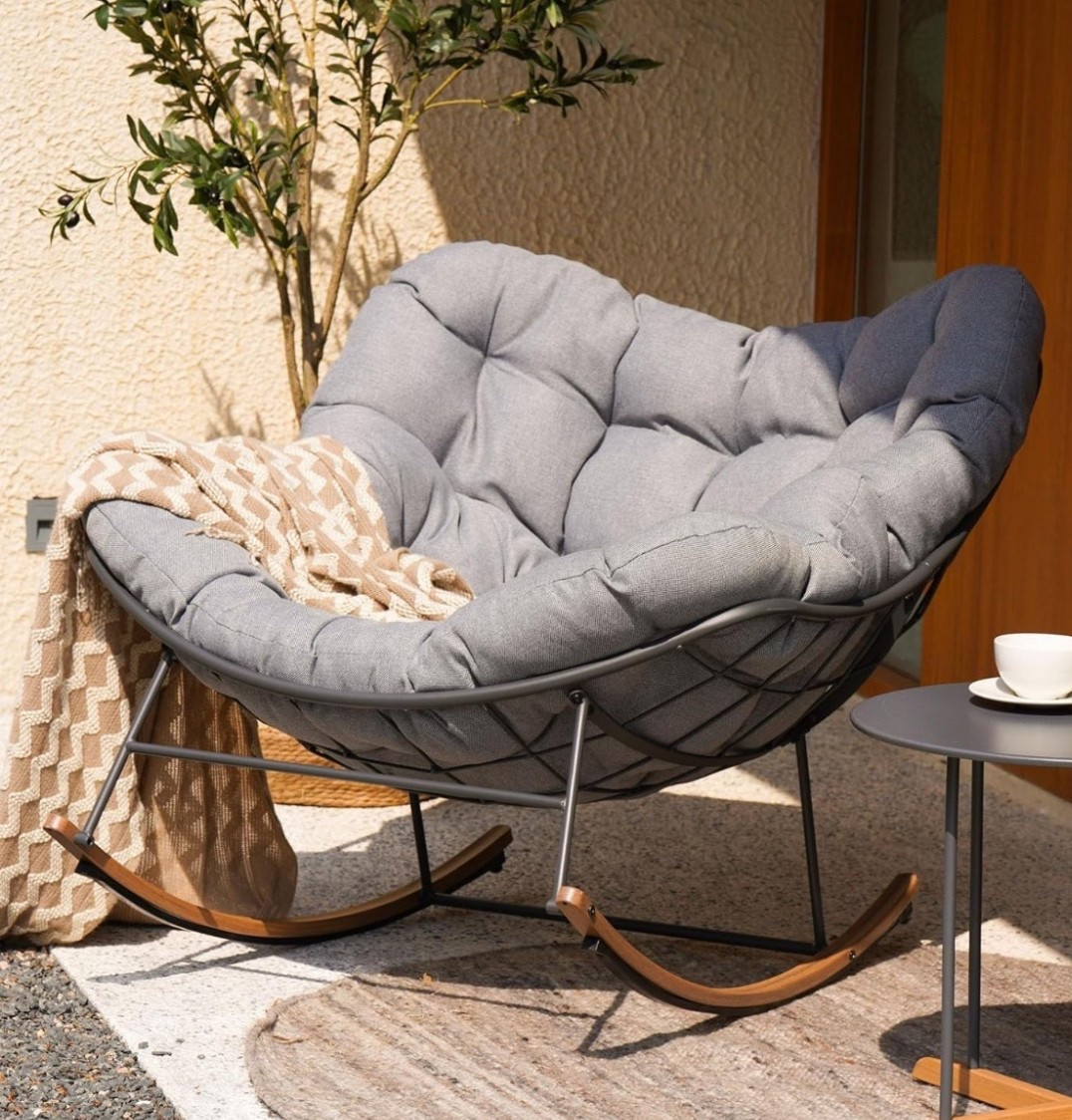 Slow, cozy summer mornings. ☀️ This oversized papasan rocking chair is the perfect spot to sip coffee, read, and ease into the day. With its thick cushioned seat and gentle rocking motion, it brings a calm, relaxed energy to your balcony, patio, or living room. Soft, cozy, and made for those quiet moments when time feels slow and easy. 🩶

#LTKSeasonal #LTKselfcare #LTKHome