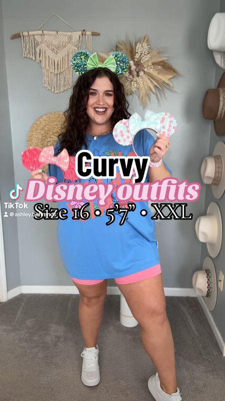 Disney themed amusement park outfits 🏰🐭🎆 Curvy approved Disney outfits. Oversized graphic tee + biker shorts, workout tank top + skort, off the shoulder romper, athletic dresses with built in shorts. Spring/Summer colorful outfits. 
Graphic tees: 3X (size up for oversized)
Shorts: XL
Tank top: XXL
Skort: XL
Romper: XL, tall 
Black biker shorts: 1X 
Neon biker shorts: XL 
Tennis dresses: XL
Graphic tee colors are Heather sea green + neon pink.
Mickey ears custom from a small business on Etsy. Exact styles are sold out, linking similar options from seller
#disneyoutfits 

#LTKstyletip #LTKVideo #LTKfamily