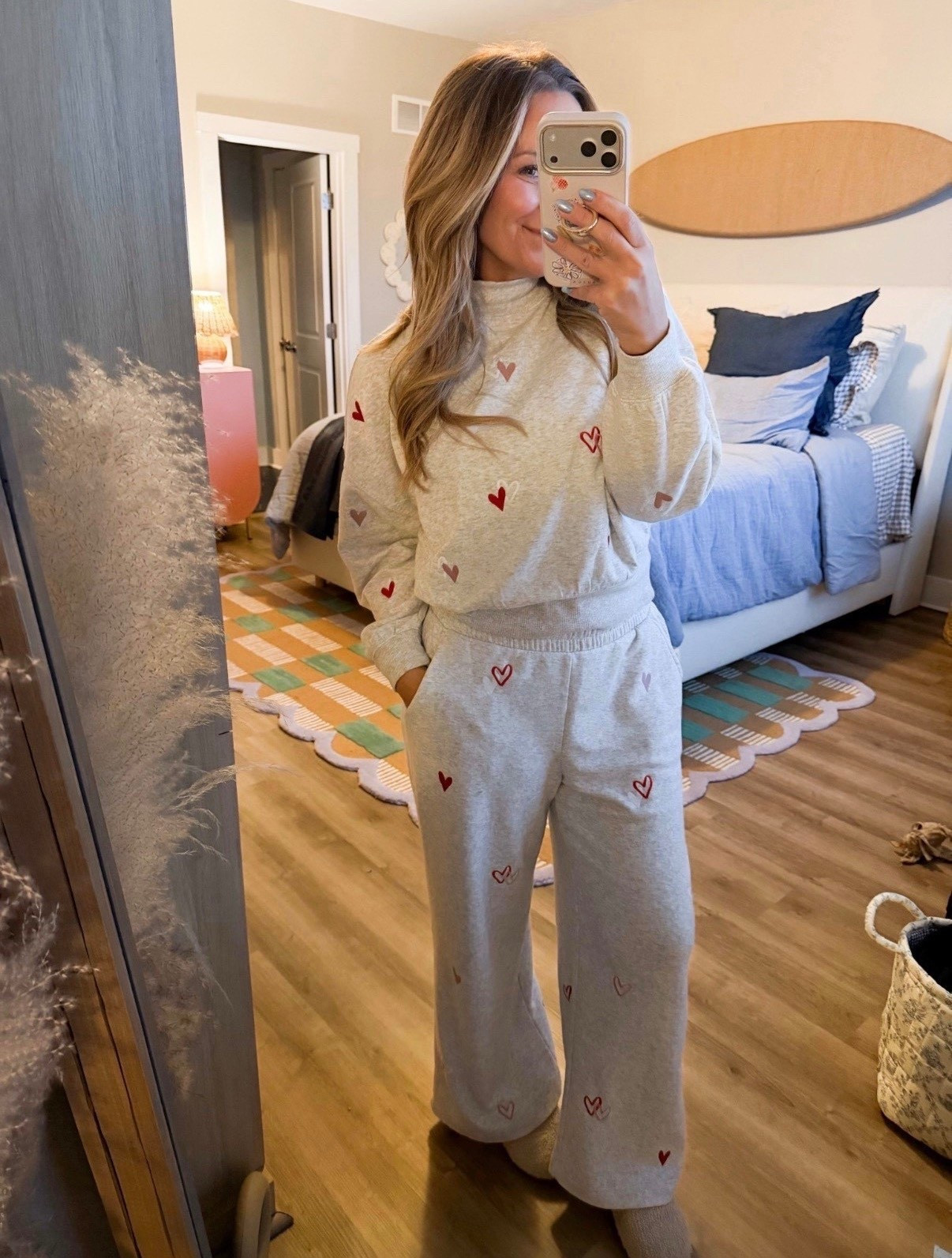 This is the kind of outfit that makes staying in feel special. Soft, comfy, and just the right amount of cute with the subtle heart details. Perfect for lounging, slow mornings, or a cozy night at home when you still want to feel put together. Linking the full set here.

matching sweat set, cozy lounge outfit, heart print sweat set, comfy loungewear, casual mom outfit, stay at home outfit, soft sweats