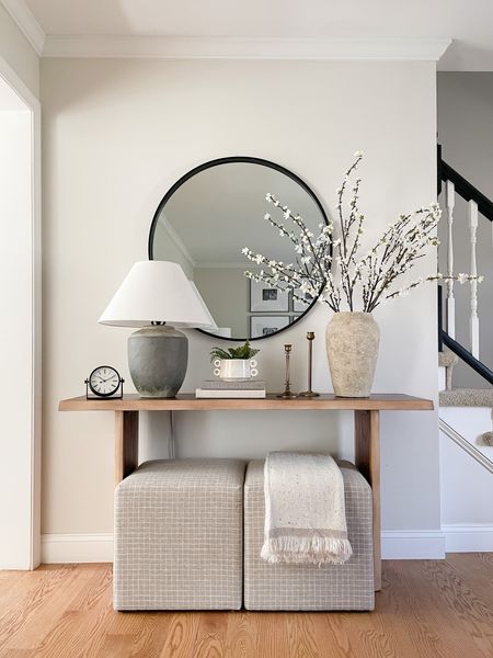 Console table, spring faux stems, ottomans, round mirror

#LTKhome #LTKstyletip