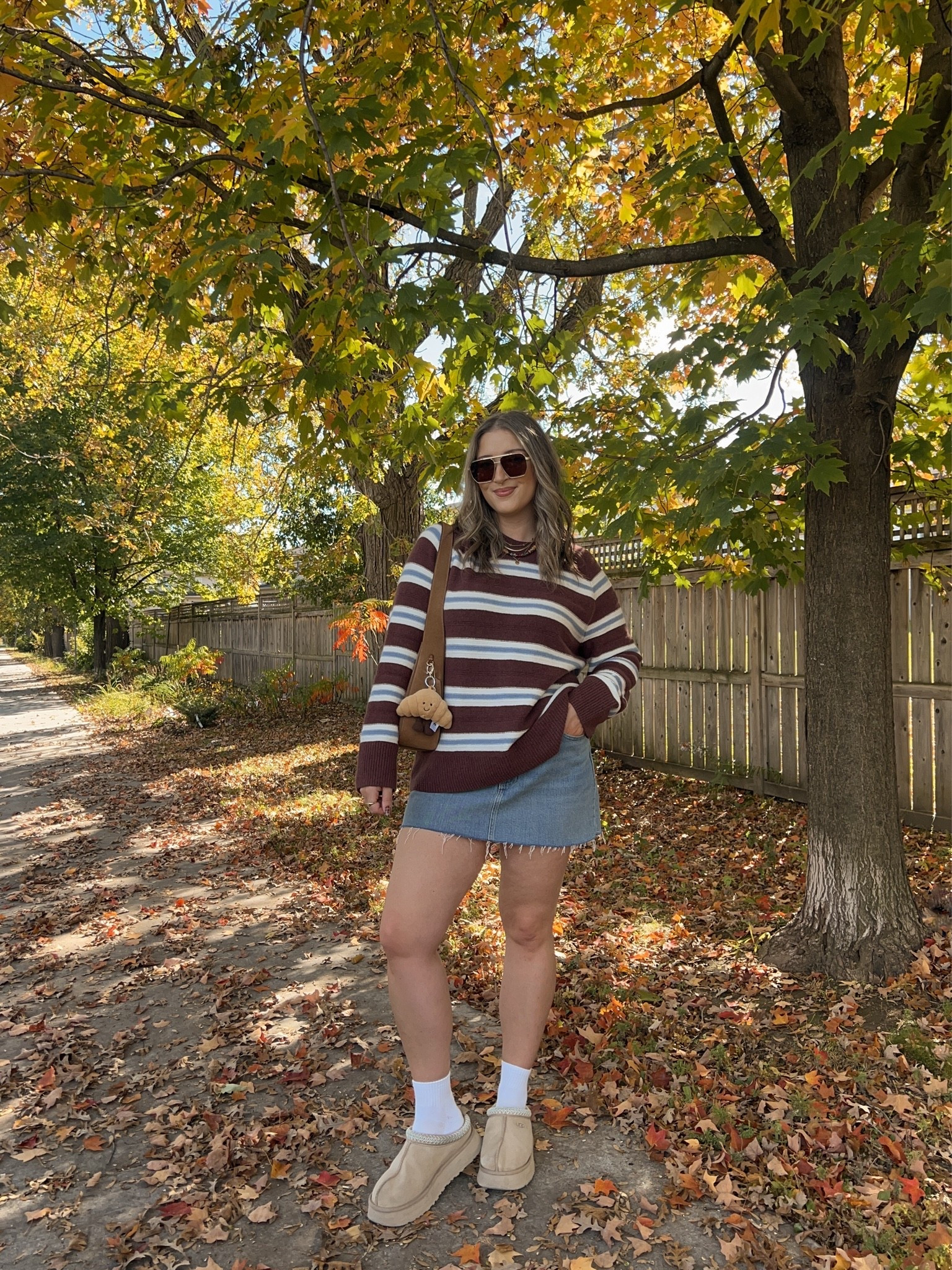Casual fall outfit! Sized up to XL in the striped sweater for an oversized fit. I bought this Abercrombie denim skirt last year in a size 32, if I was repurchasing I would get a 30 or 31. I’m a 30 in their jeans! Ugg Tazz platforms are so comfy and TTS

#LTKfall #LTKstyletip