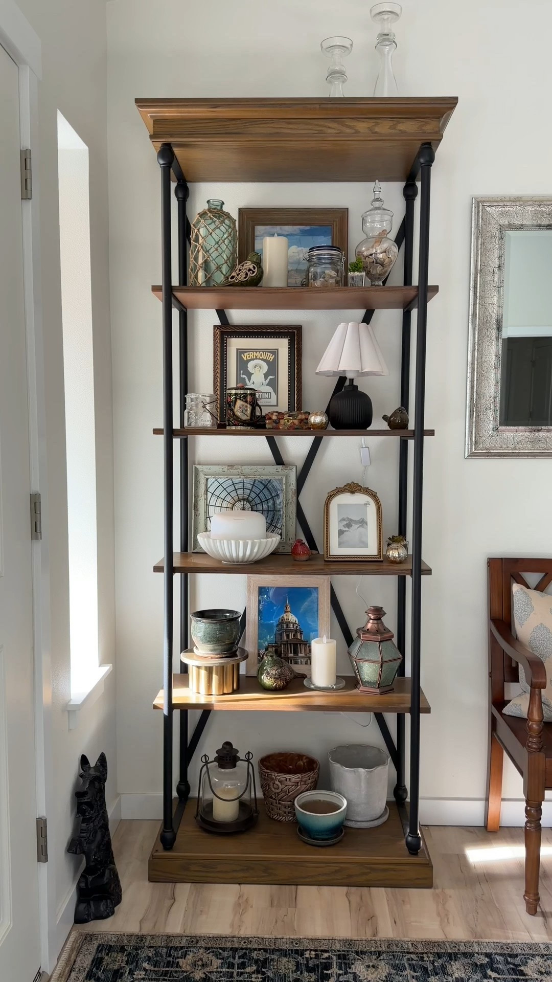 I needed a really tall shelf for our entry and this one is perfect. It’s on sale for less than I paid right now too. The bars are black metal, the top and bottom are wood and the shelves are manufactured wood on this bookcase  

#LTKHome #LTKSaleAlert