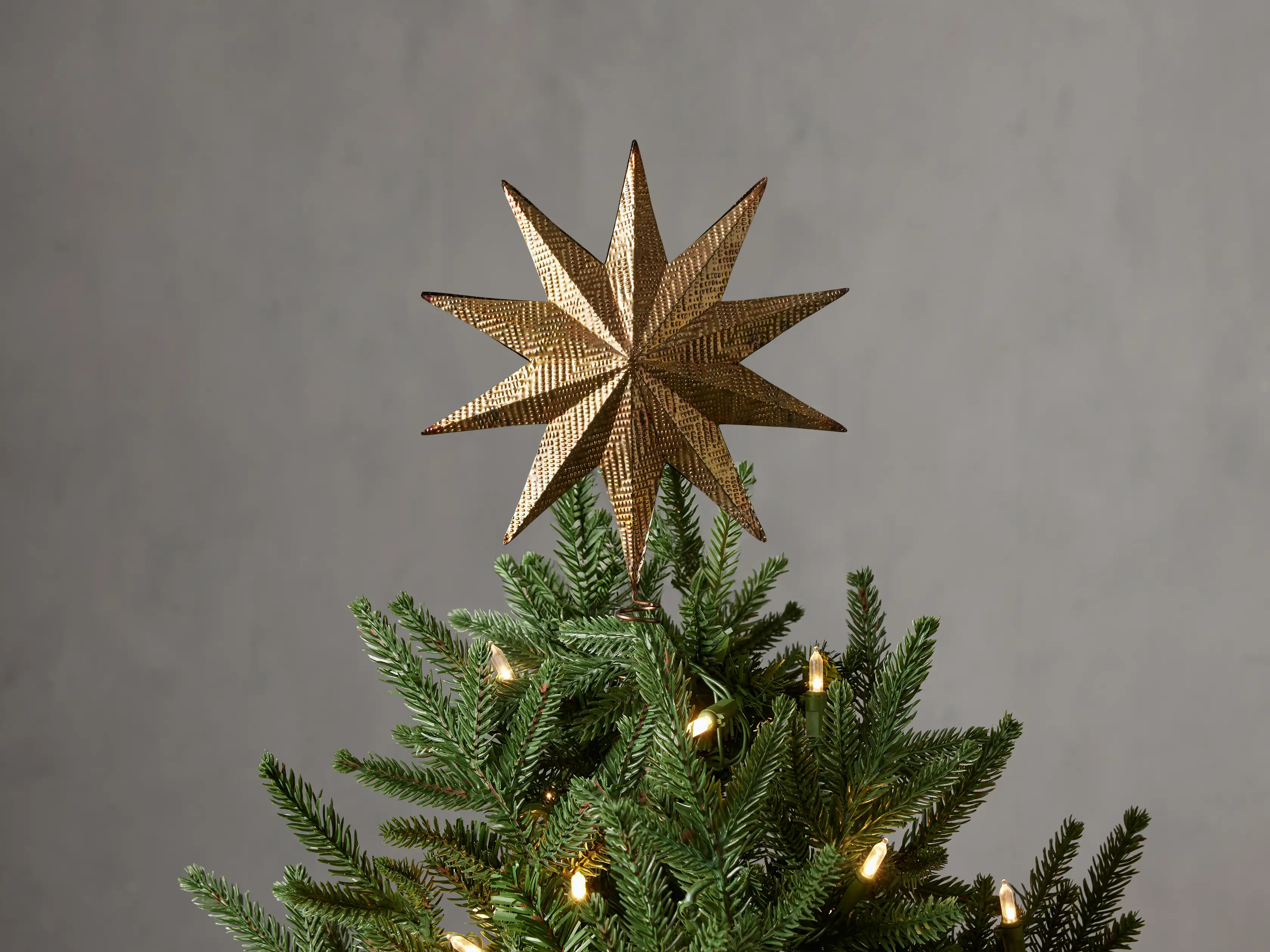 Embossed Star Tree Topper in Brass | Arhaus