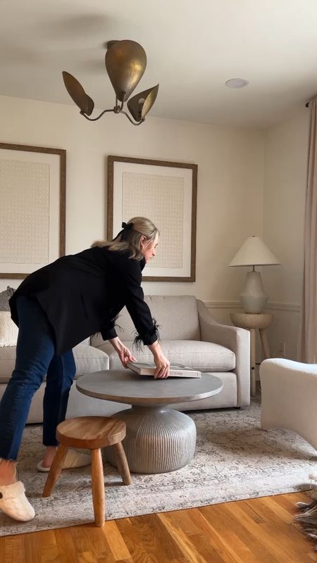 Styling is HARD WORK! 🤣 coffee table styling, Wabi sabi decor, brutalist home decor, round coffee table, silver vase, iron candlesticks, coffee table books 

#LTKfindsunder100 #LTKMostLoved #LTKhome