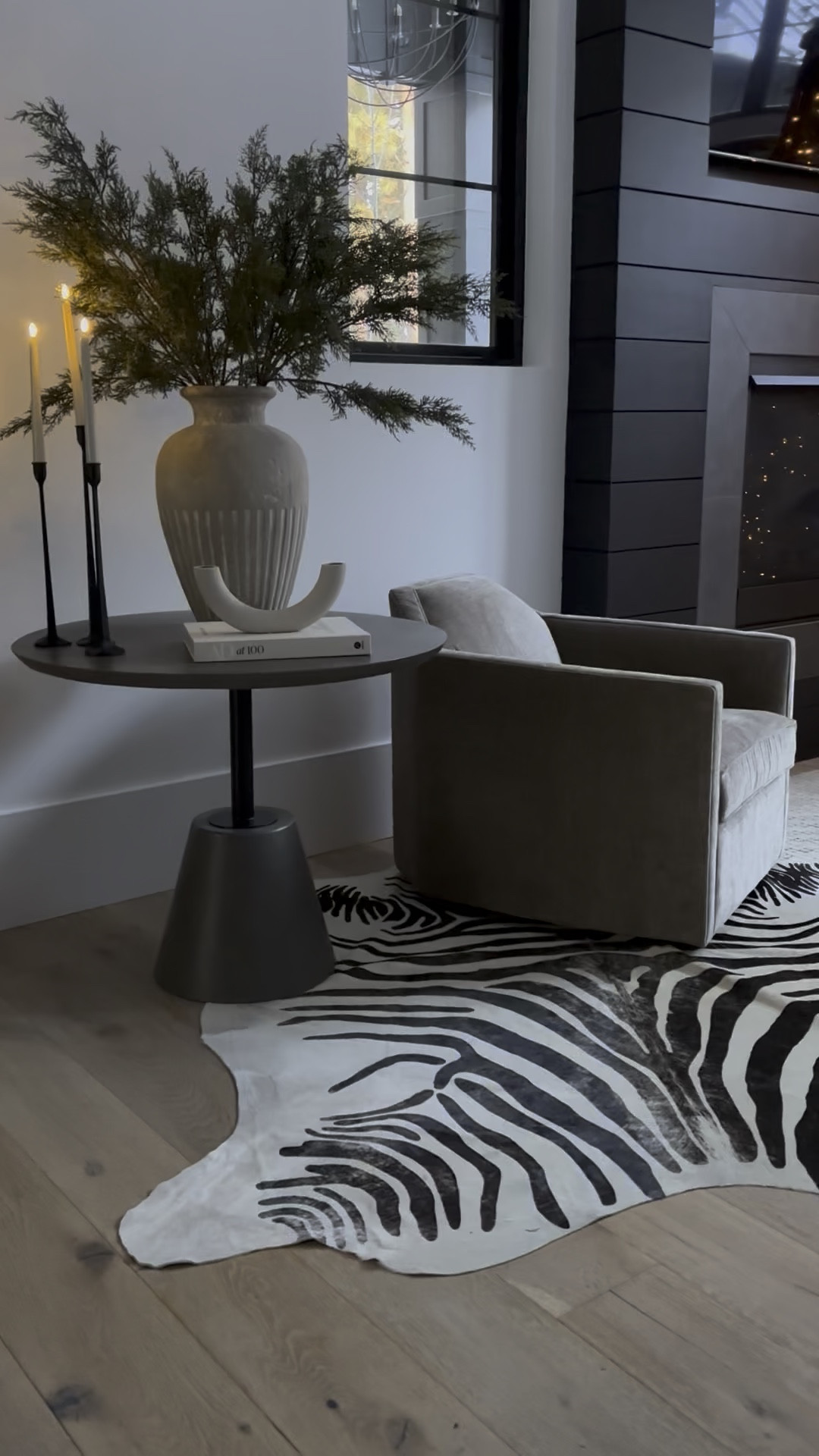 Current look in the hearth room. New swivel chairs, one will go where the tree is. New marble top coffee table. Took this zebra rug from another room. LOVE IT! Design tip - if your area rug is too small, try layering with this zebra rug to extend the placement of furniture. 
#LTKHoliday

#LTKSeasonal #LTKHome