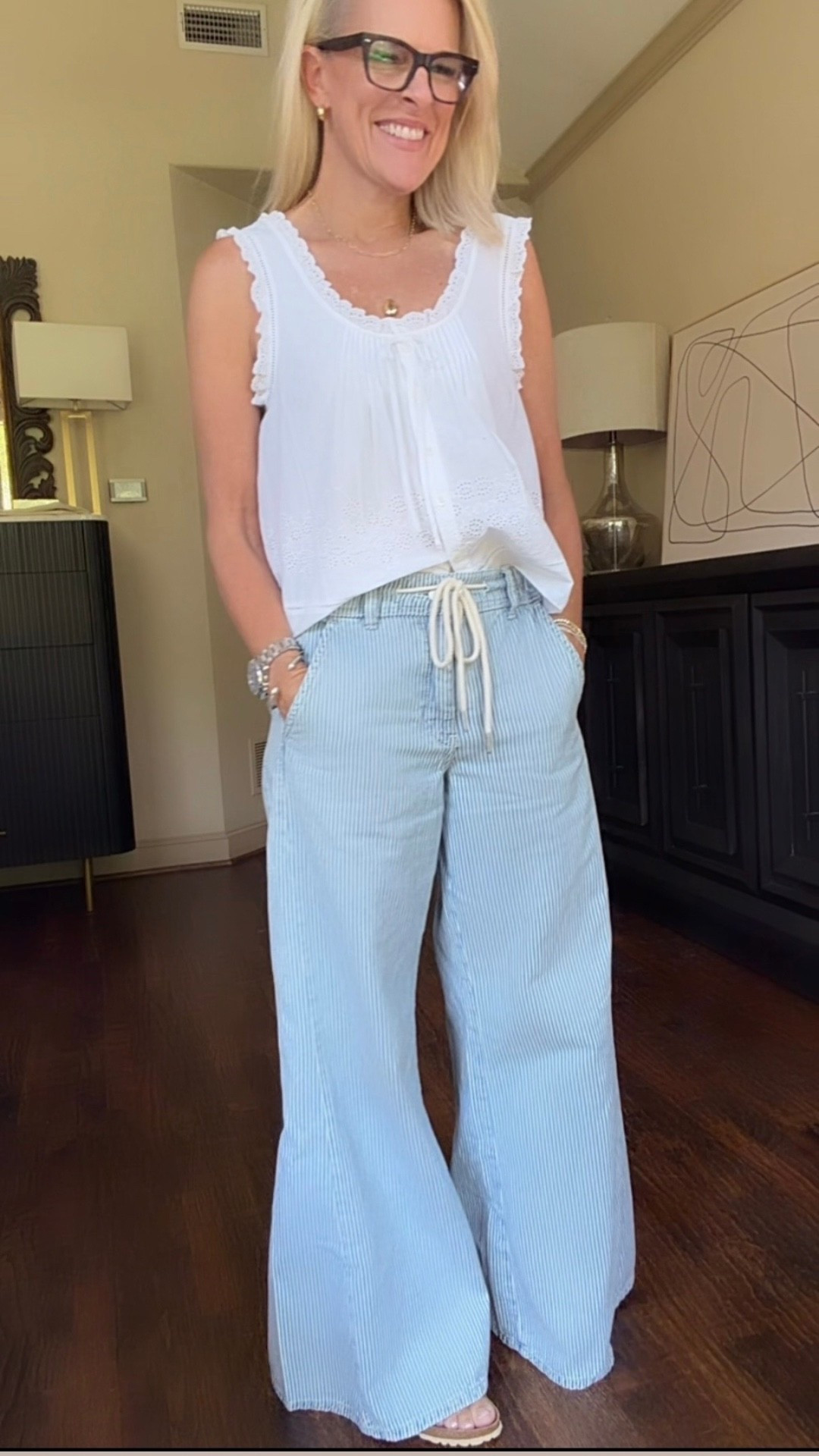 I love a pretty top that doesn’t require much styling—and this one is exactly that. The feminine eyelet details instantly dress up these relaxed wide-leg jeans, while the soft blue-and-white combination keeps the whole outfit feeling easy and comfortable.

💡 LTK MADE EASY
❤️ Heart = Support my posts!
🔖 Save = Get sale & restock alerts
📋 Lists = Keep favorites organized
📲 Share = Send lists and products to a friend. Hello, Christmas List!
💬 Comment = Ask me anything about what I’m wearing.:-)

#LTKootd #LTKOver40 #LTKgrwm