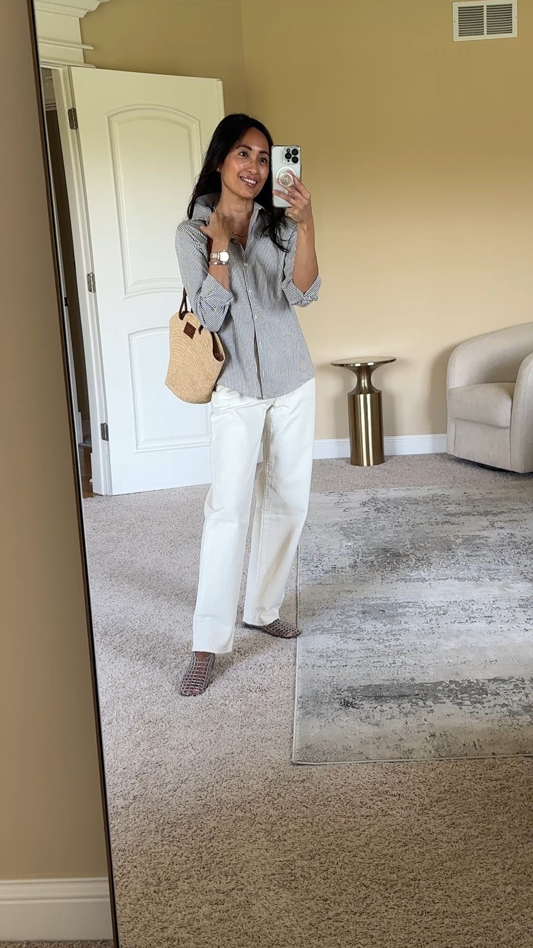 Off- white jeans outfit idea. Modern classic styling with looser fits and jelly flats for a casual vibe. 
- I prefer off- white colors like this ecru for a less formal feel than stark white. 
- Exact jeans are my favorite 100% cotton denim material. Sizing runs big, but I like the relaxed fits for more casual outfits. 
- Striped button down Spring staple piece to dress up or down. Exact top runs small. 
- Jelly flats are nostalgic, but feel fresh in this designer inspired style. True to size or size up if in doubt. I aired them out in the garage a couple of days to get rid of the plastic smell  
- Straw tote bag is a classic warmer weather choice. 


#LTKFindsUnder50 #LTKFindsUnder100 #LTKOver40