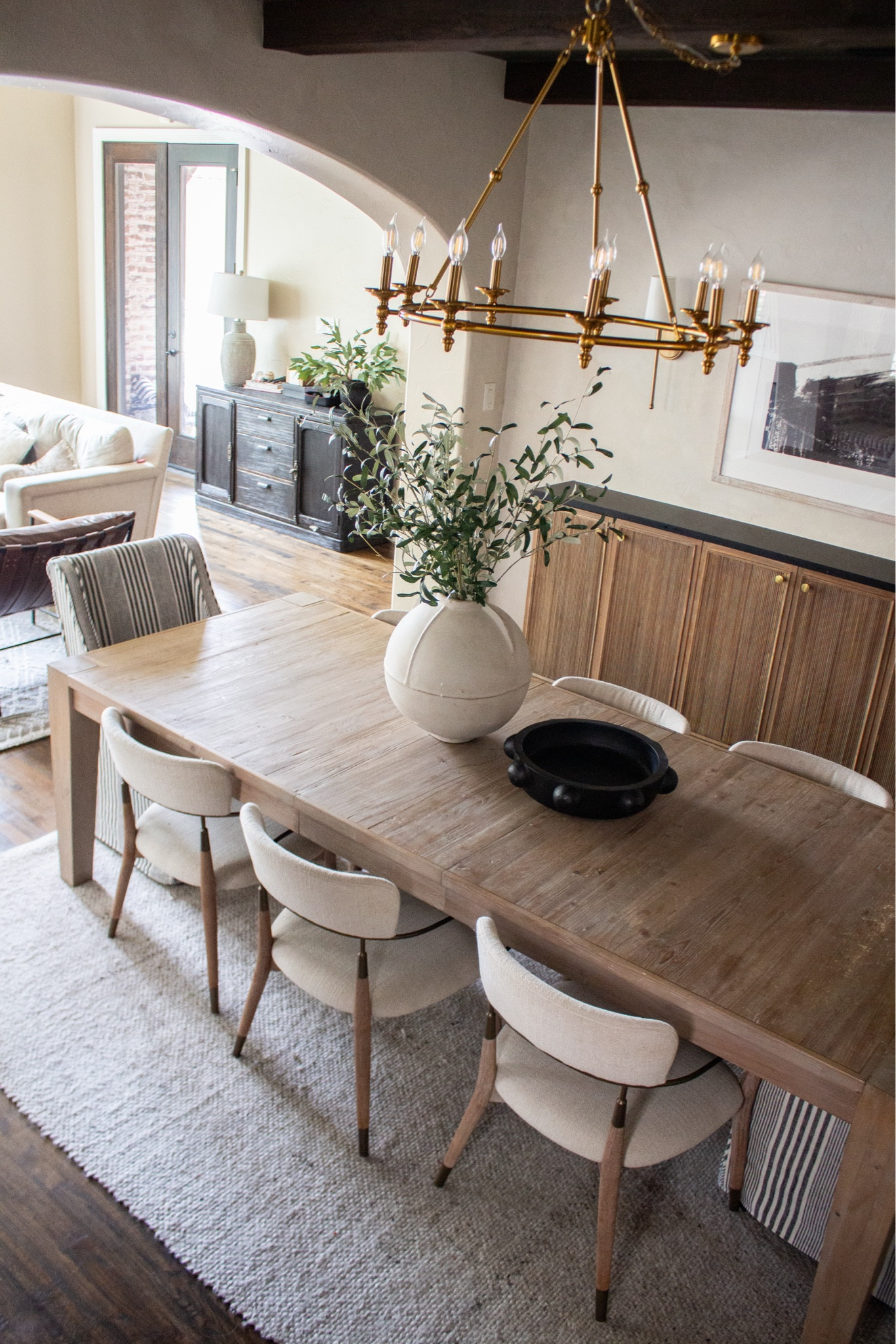 A dining room that feels warm, timeless, and effortlessly elevated. The natural wood table, neutral chairs, and brass chandelier create such a beautiful layered look that feels both modern and classic.

neutral dining room, wood dining table, brass chandelier, modern classic dining room, neutral home decor, dining room inspiration, warm wood furniture, modern traditional style, dining room styling, timeless home design

#LTKSeasonal #LTKHome