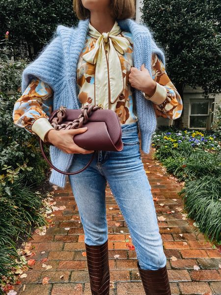 I love a pretty print top with chunky cardigan and cool clutch. 

#LTKSeasonal #LTKitbag #LTKover40