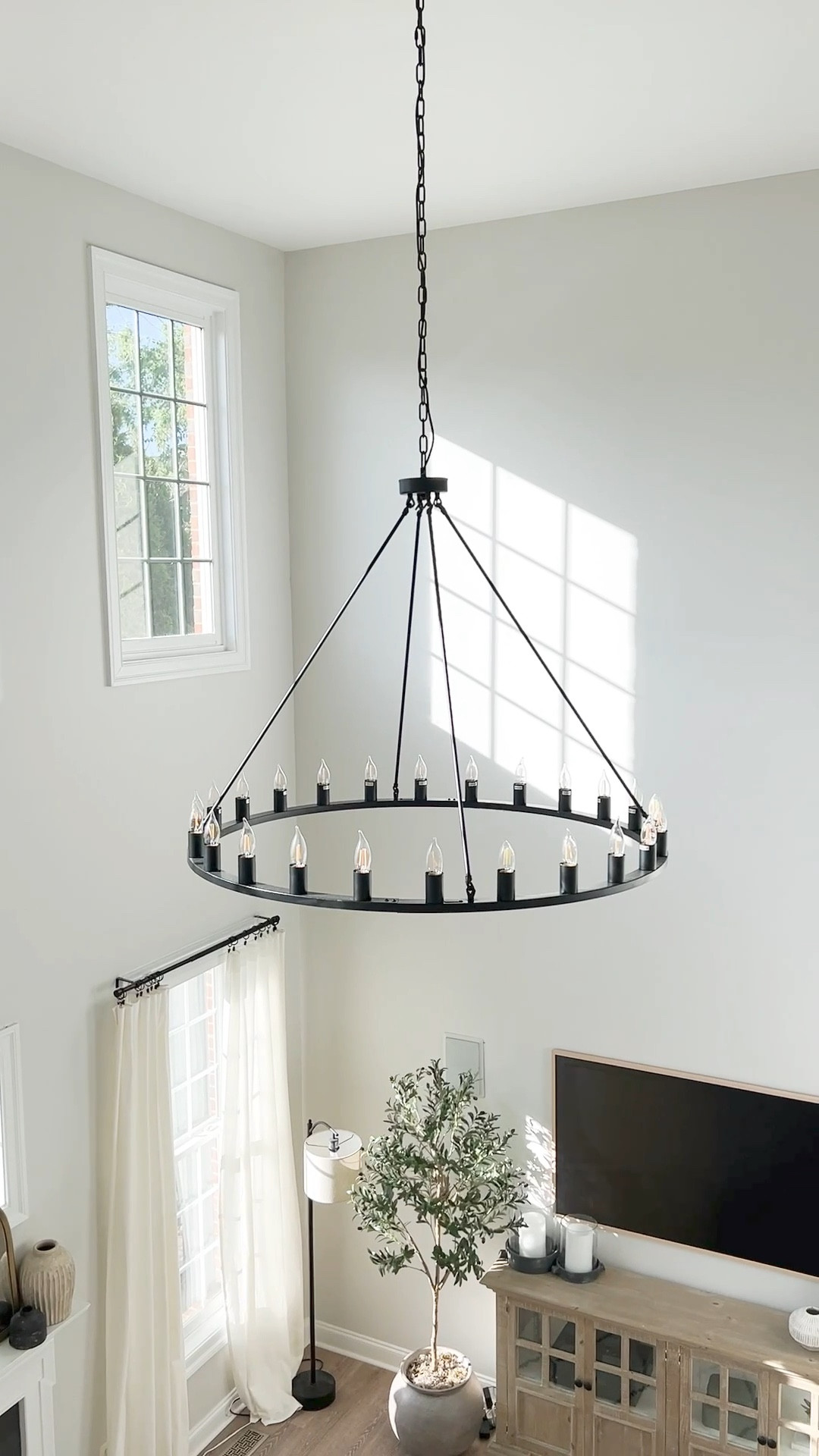 Chandelier, the Home Depot, wagon wheel, black chandelier, light fixture, living room, lighting, family room, entryway

#LTKhome #LTKstyletip #LTKFind