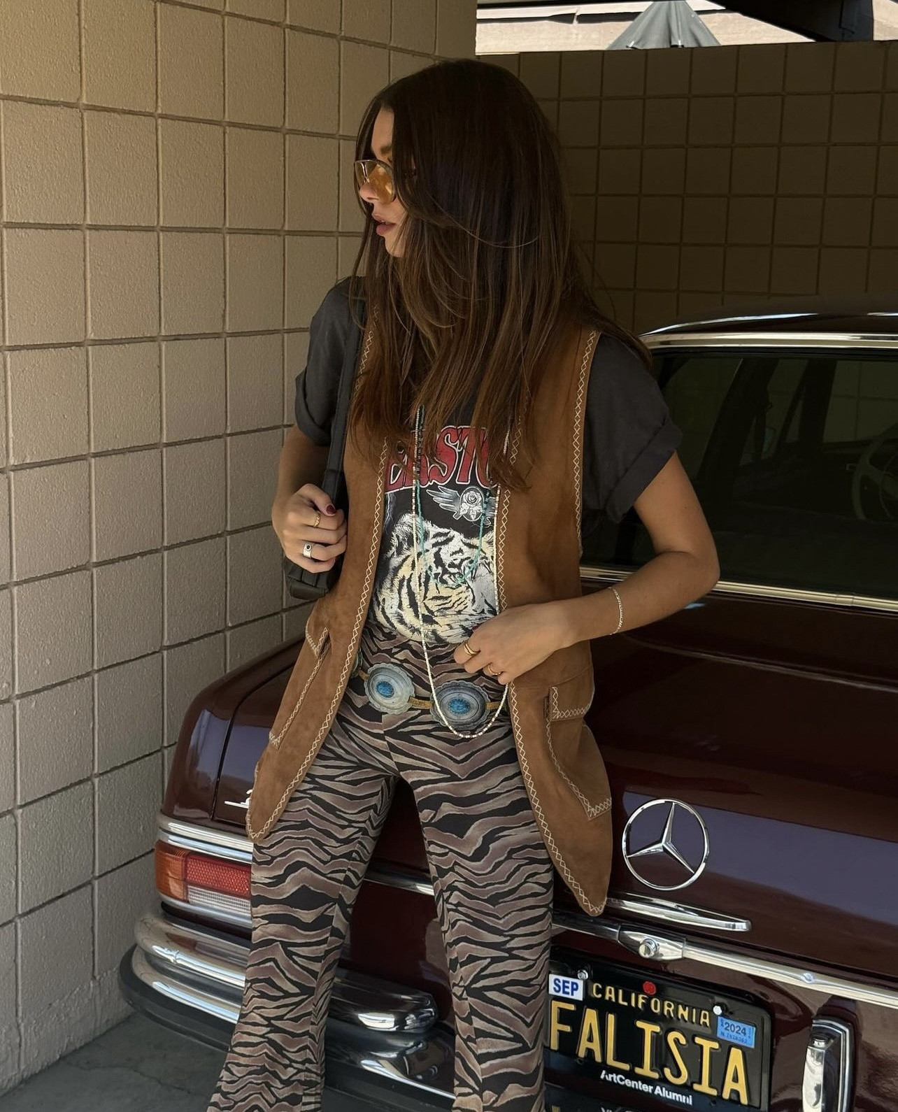 festival outfit — biker tee, suede vest, bell bottoms + cowboy bootss
