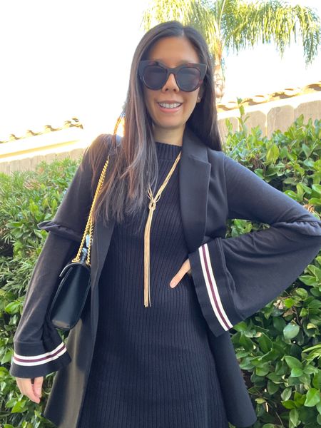 An all black Winter look! I wore my knitted flare sleeve dress with a sleeveless duster vest. For accessories, I chose gold accents. I used to wear a lot of statement jewelry but that ended during in grad school. However, I occasionally pull out some bold things for minimal outfits.

#LTKSeasonal #LTKstyletip #LTKworkwear