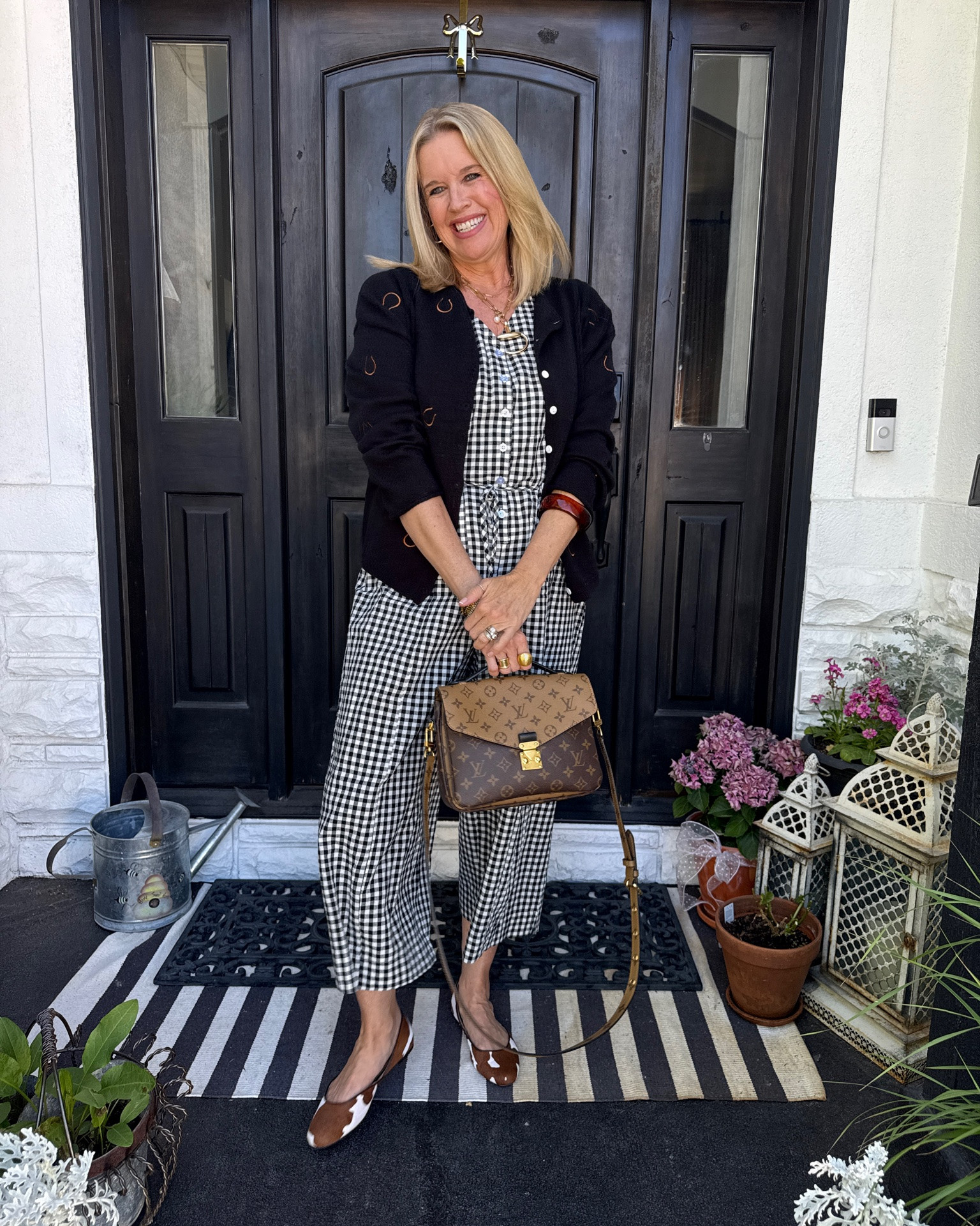 Styling gingham over 40

This affordable gingham jumpsuit is so easy to wear, throw on and go
Light weight, tts in a med
Tank top style sleeve

Paired with a fun horse shoe cardigan 

Cow print shoes 

Horse bit necklace 

Louise button badge

And large resin cuff

#LTKootd #LTKgrwm #LTKOver40