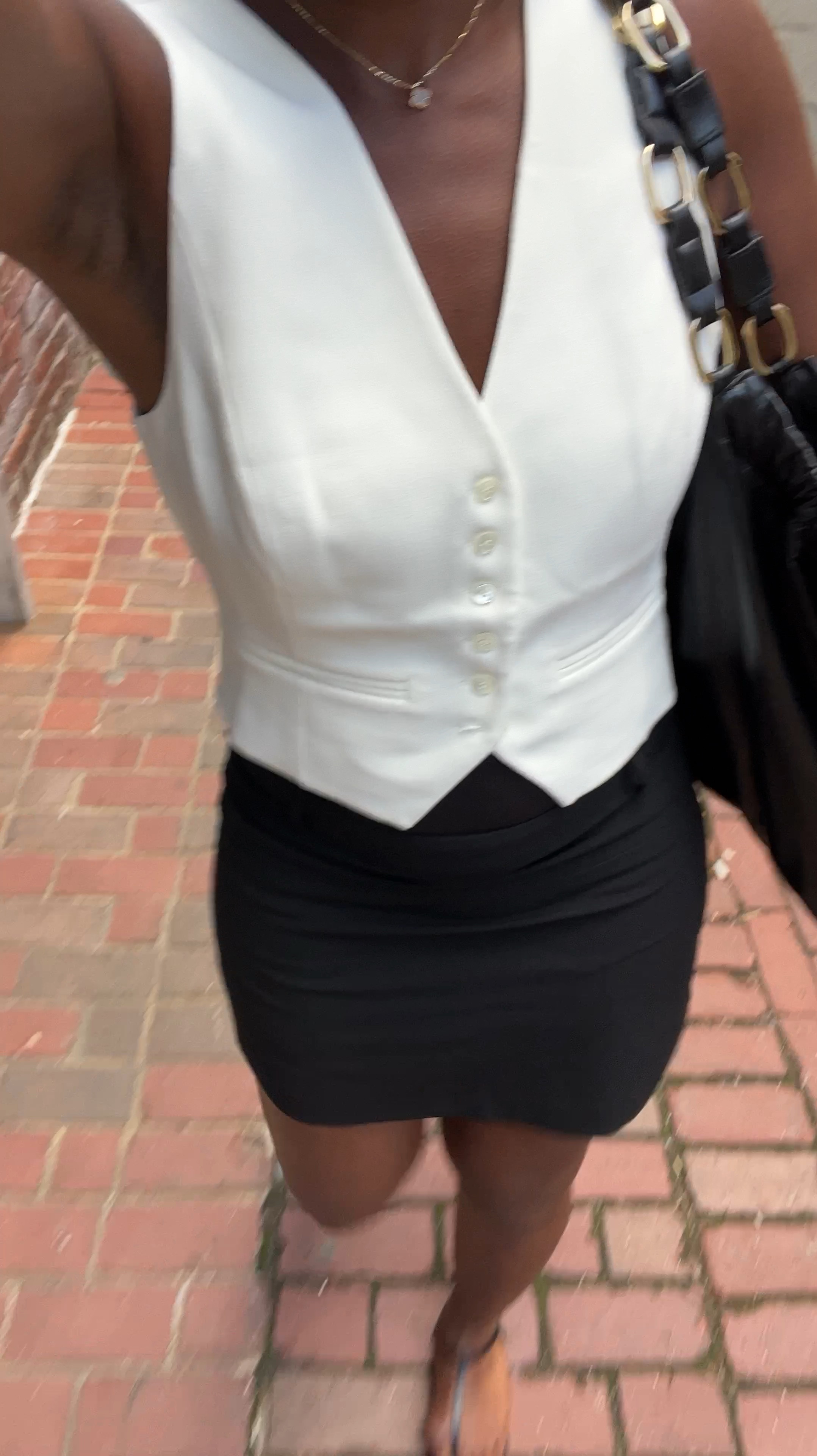 Easy chic outfit for dinner, styling a black mini skirt with white vest. 

#LTKVideo #LTKStyleTip #LTKSeasonal