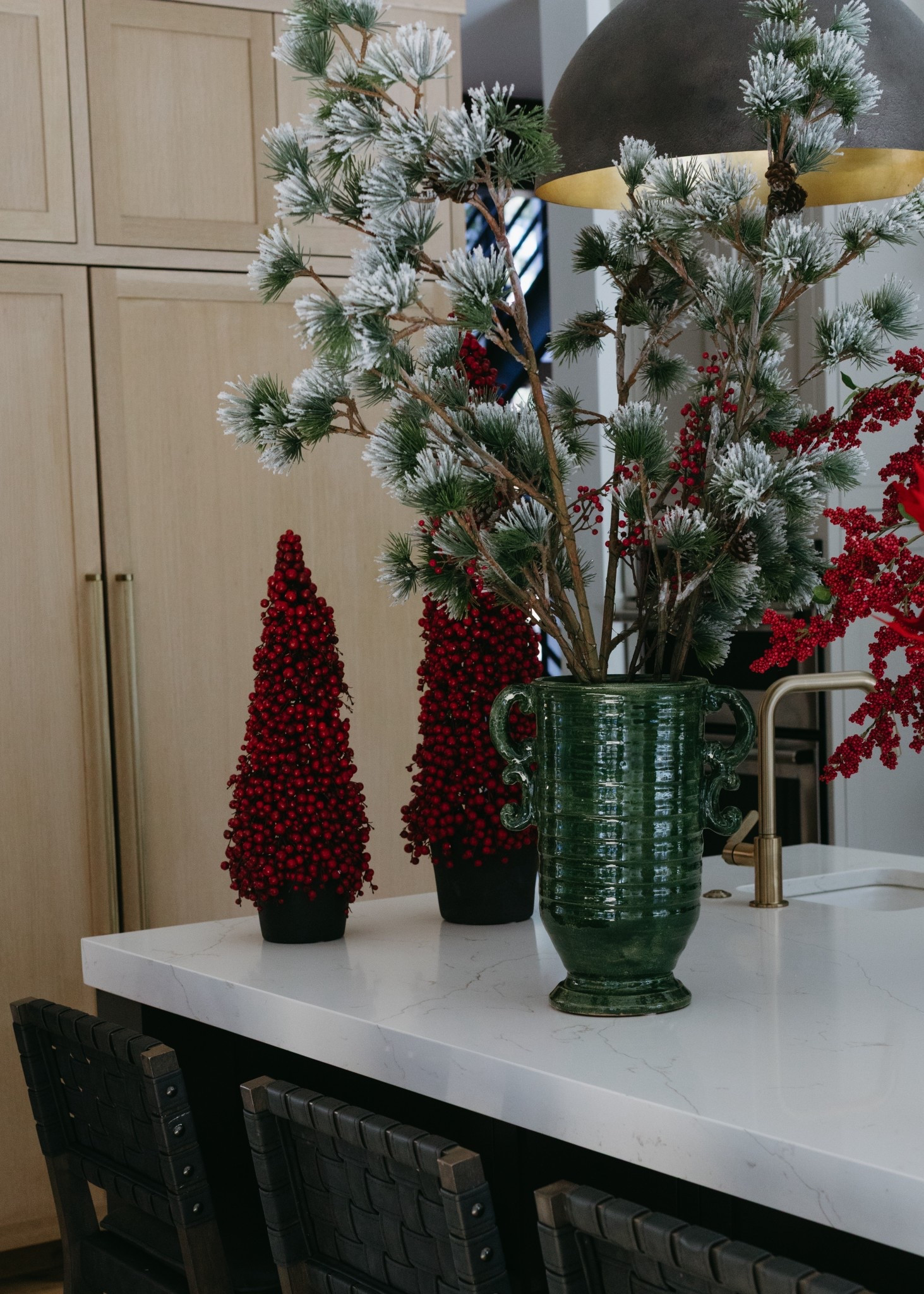 This is the taller of the two ceramic vases. When you style stems at different heights, it creates such perfection dimension. The dark green looks so good in contrast with the faux red berries and the white snowy stems!

#LTKSeasonal #LTKHome #LTKHoliday