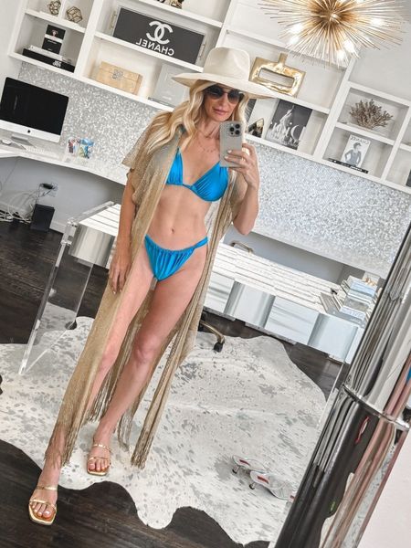 I’m absolutely obsessed with this stunning Under $100 bikini from Target! The ruching is so flattering and the fit is incredible 💙 I’m wearing a size small and it fits tts.#swimsuit #sandals #summerwear

#LTKstyletip #LTKfindsunder100 #LTKswim