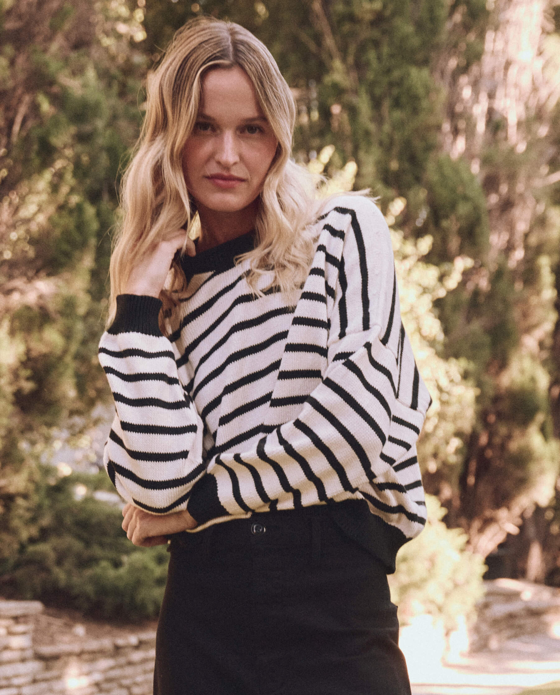 The Roll Neck Pullover. -- Black and Cream Stripe | THE GREAT.