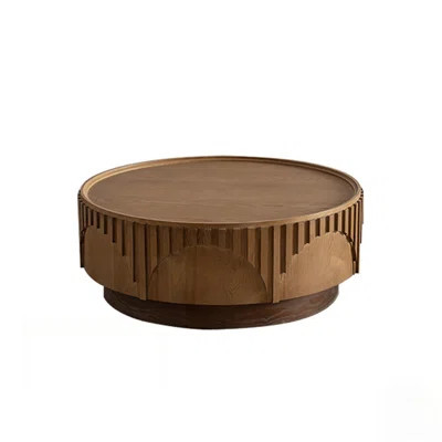 Round Wooden Coffee Table with Handcrafted Relief and Sturdy Pedestal for Modern Living Spaces | Wayfair North America