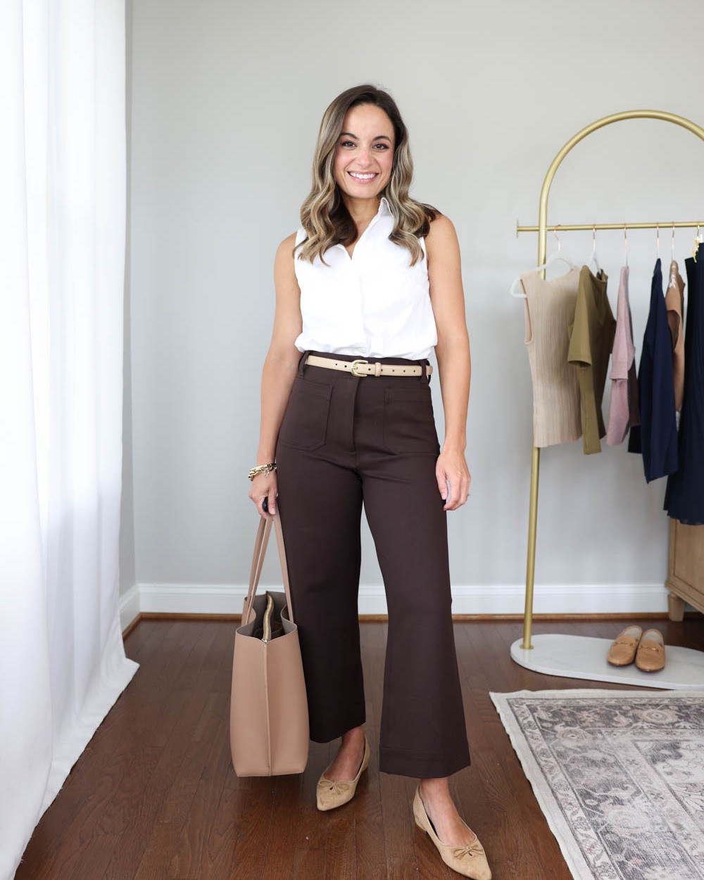 Three ways to style a sleeveless cotton poplin shirt for the office this Fall!

Sleeveless Poplin Top (JCrew Factory): xxs 

Outfit 1:
Brown pants (Quince): 0 short - 11” rise 24” inseam 
Belt (Quince): xs in mushroom 
Pointed toe flats (Sam Edelman): true to size 

Outfit 2:
Navy skirt (Aritzia): xs 
Tote bag (Quince)
Pointed toe heels (Sam Edelman): true to size 

Outfit 3:
Pink sweater (Quince): xs 
Navy pants (BR Factory): petite xxs - 27.5” inseam 
Pointed toe flats (Sam Edelman): true to size 

Business casual, petite friendly work outfits, petite fashion