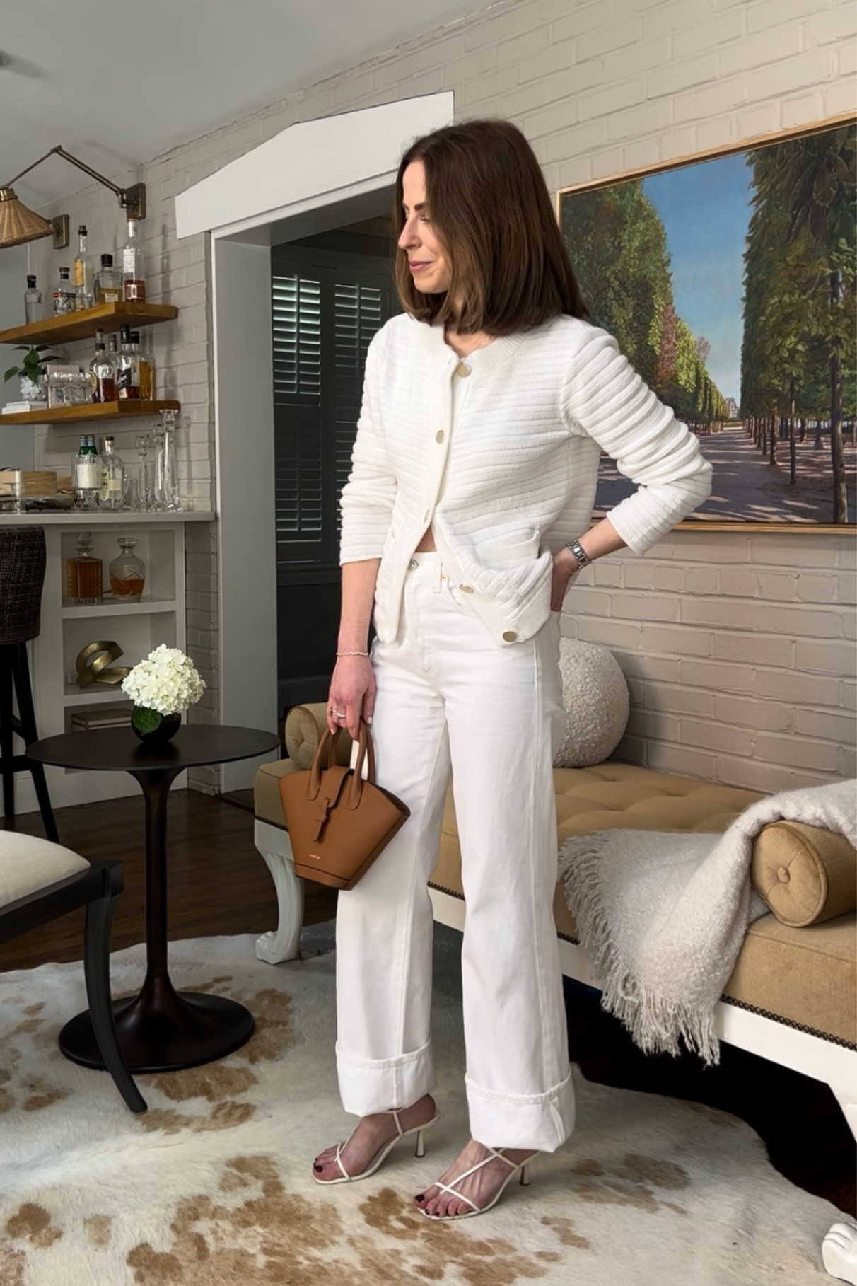 White cardigan jacket EVEREVE 
White wide leg jeans citizen of humanity 
Tan top handle leather bag Paris 64
White minimal strappy heel studio Amelia 

#LTKitbag #LTKstyletip #LTKshoecrush