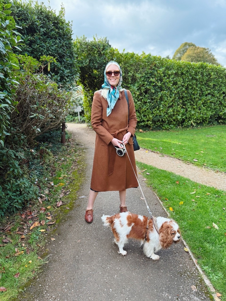 Channelling my inner Princess Margaret today with a silk scarf and sunnies - and she also had Cavalier King Charles Spaniels! Clemmie  certainly coordinates beautifully with my new pure wool Livia Coat in Vicuna by Hobbs London 🐶 

I’ve always loved a belted coat and this style has it all - soft, luxurious fabric and a flattering cut with concealed front buttons. The Livia coat also comes in Petite, plus several colours including camel and a dark green. 

I partnered with tan brogues, Ralph Lauren tortoiseshell sunglasses and the very special Robin Silk Scarf in Teal by Aspinal of London which was a fab present from my in-laws last Christmas (gift idea)  🍁 

#LTKautumn #LTKeurope #LTKuk