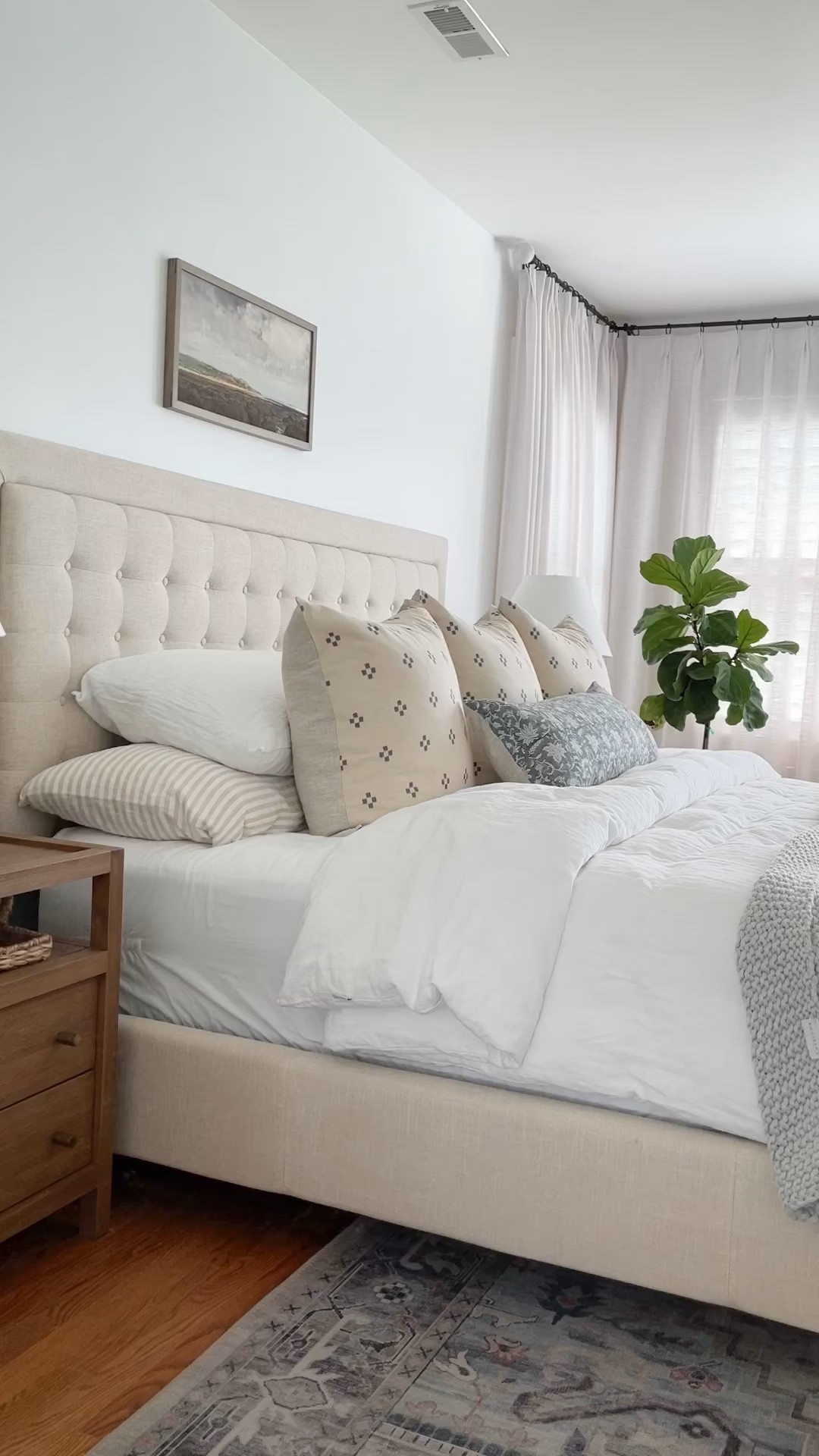 Here is a tour of my original bedroom styling. This is not a large room but I like there is no wasted space. A few highlights:
The upholstered low profile bed is from Walmart and the solid espresso wood nightstand is from Crate and Barrel. 
The white and blue dot pillow is from Etsy and the ceramic lamps from pottery barn. Of course I finish with the famous Amazon pinch pleated drapes

#LTKstyletip #LTKhome #LTKFind