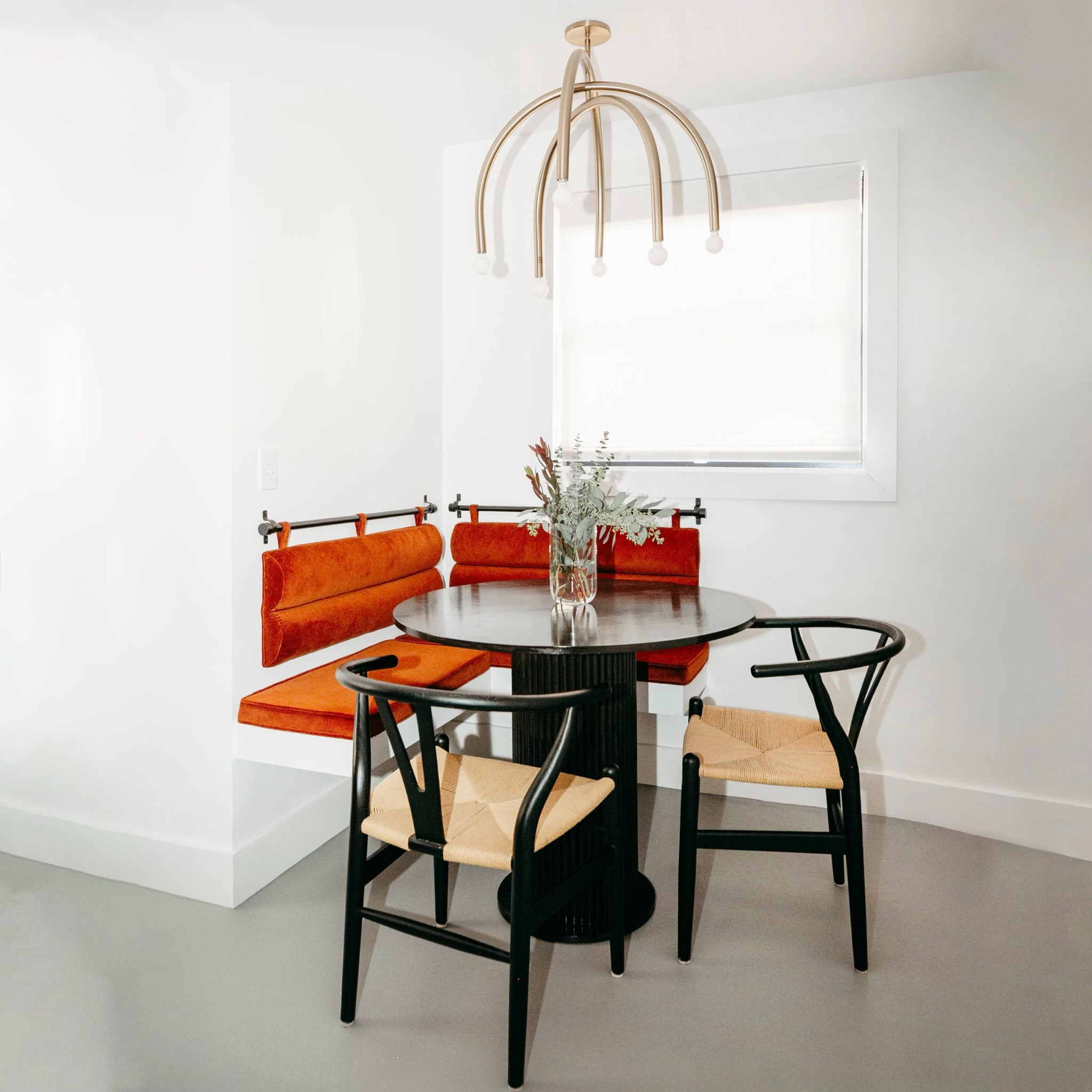 as part of our #dwelloctoberrealestate service, we worked with a client to find them an abandoned and foreclosed mid-century modern fixer-upper and then transformed it into their dream home through our #dwelloctoberstudio design service. this custom built banquette and dining table was a nod to the original built in bench. #dwelloctober

#LTKhome