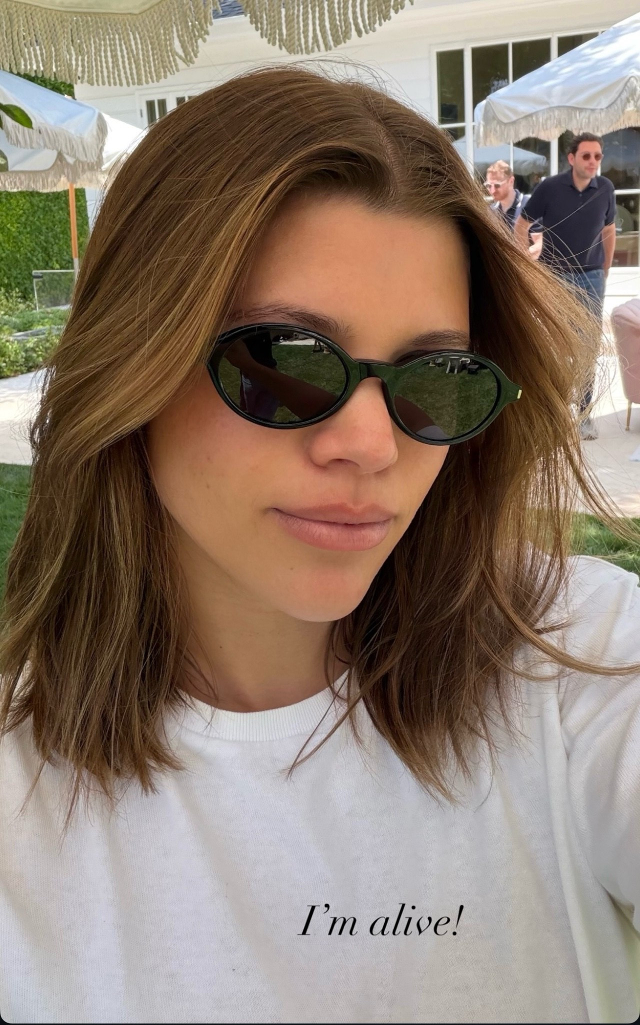 Sofia Richie Grainge black oval shape enriched by the corner angle metal detail.