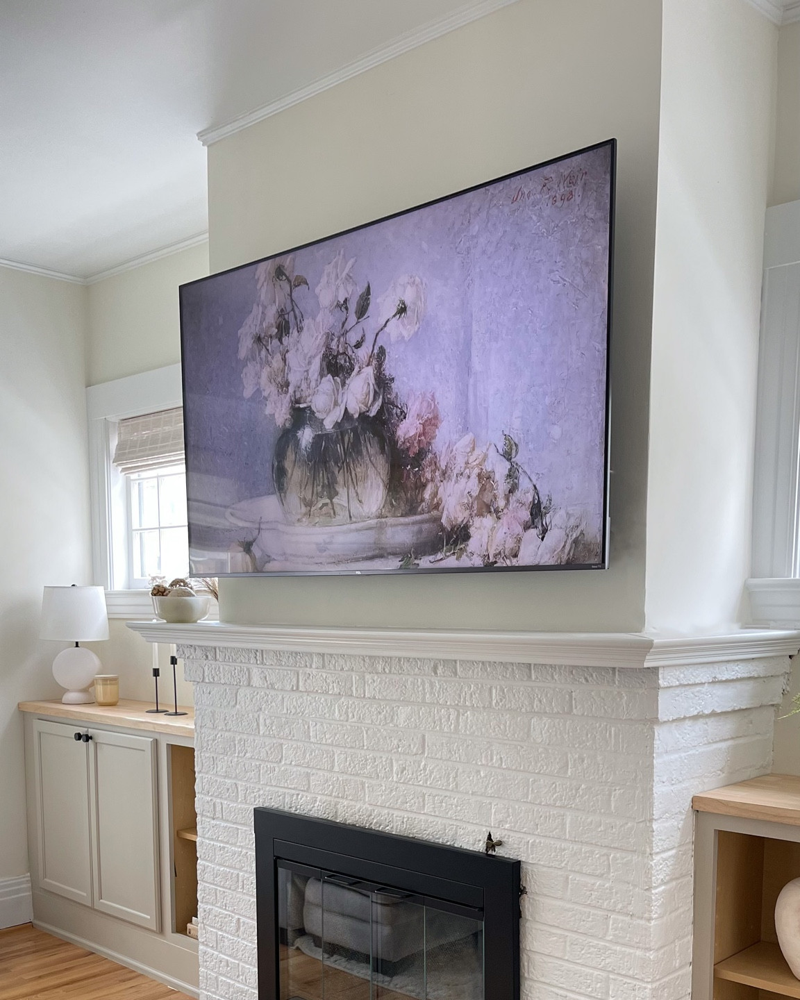 Fireplace styling details and living room tv. Neutral living room decor, white walls, white paint, Victorian home
Paint: Swiss coffee

#LTKhome