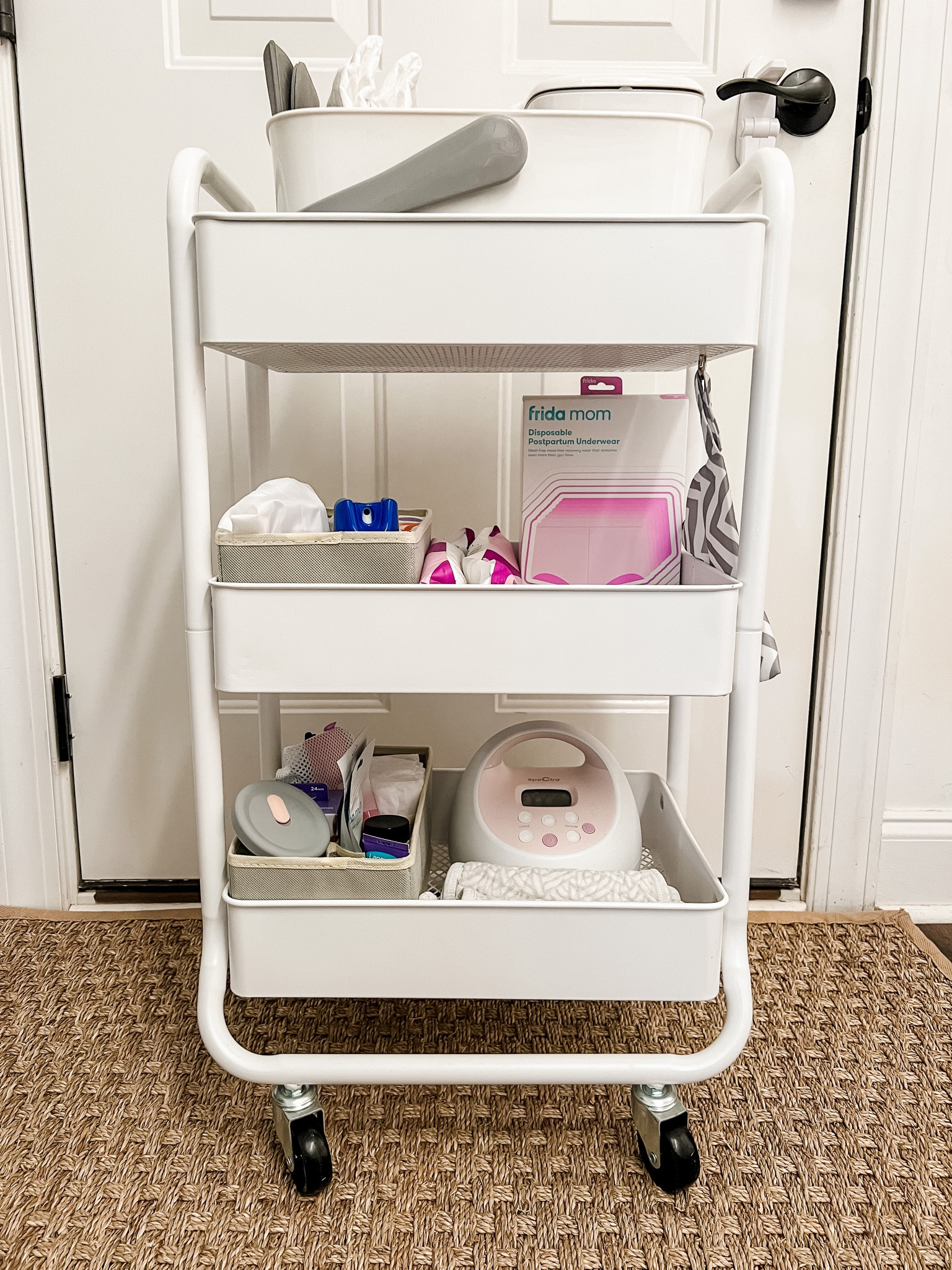 Nursing cart inspired by Karrie Locher and tailored to what has proven the most useful for us after two kids! 

This thing comes in so handy during the fourth trimester for postpartum care and nursing/pumping. We organized the cart into levels by diaper changing, postpartum care, and breastfeeding. We also attached a small bag to the side to keep chapstick, lotion, and hair ties for me.

Once we're done using it, we like to turn it into our toddler's snack cart in the pantry!

rolling three shelf nursing postpartum cart | spectra breast pump | aden and anais absorbent muslin burp cloth bib | amazon breastfeeding cart divider | haakaa with lid | organic nipple balm | fridamom breast mask for nursing | legendairy milk breastfeeding supplement | nipple shields | breast heat packs | breast massager | breastmilk bags with permanent marker | postpartum organizer | fridamom postpartum underwear in boyshort and brief style | postpartum icepack pads | fridamom peri bottle | dermaplast spray | tucks | fridamom witch hazel foam | pads in various sizes | diaper changing caddy | wipe dispenser | diaper cream | all purpose ointment | mini bum brush | hand sanitizer | newborn and size 1 diapers

#LTKbump #LTKFind #LTKbaby