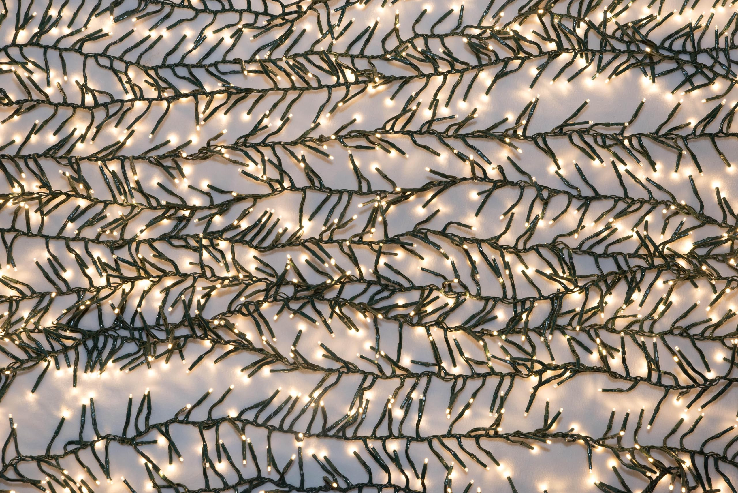 50' Connectable Cluster Light Garland w/ 1,500 Warm White LED Lights on Green Wire | Amazon (US)