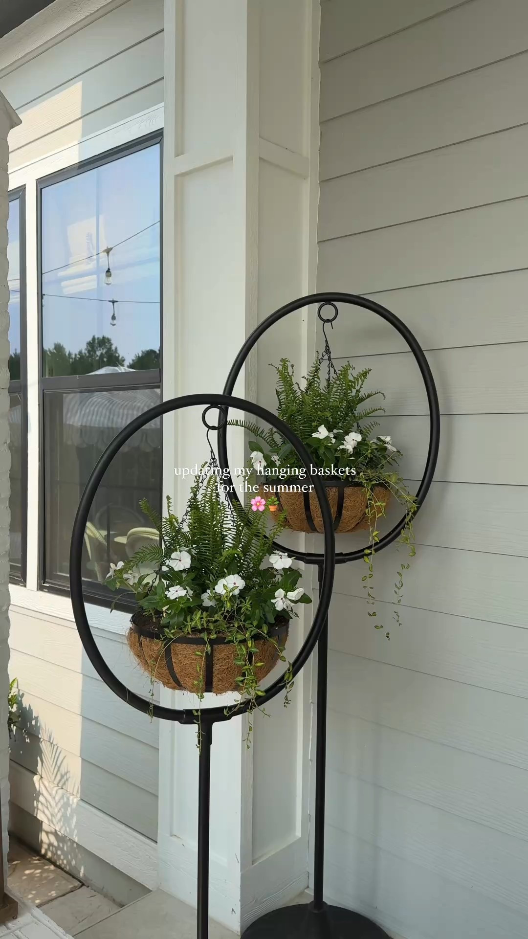 summer hanging baskets 🌸 | the prettiest flower combo for full sun to part shade: vinca illumination vine, white vinca and emerald queen fern ☀️

save for inspo 🫶🏼

#hangingflowerbasket #fullsunplants #planters #hangingbaskets #porchdecor #summerdecor #outdoorliving #porchdesign #outdoorfurniture #grandinroad 

#LTKHome #LTKSeasonal #LTKSummerEdit
