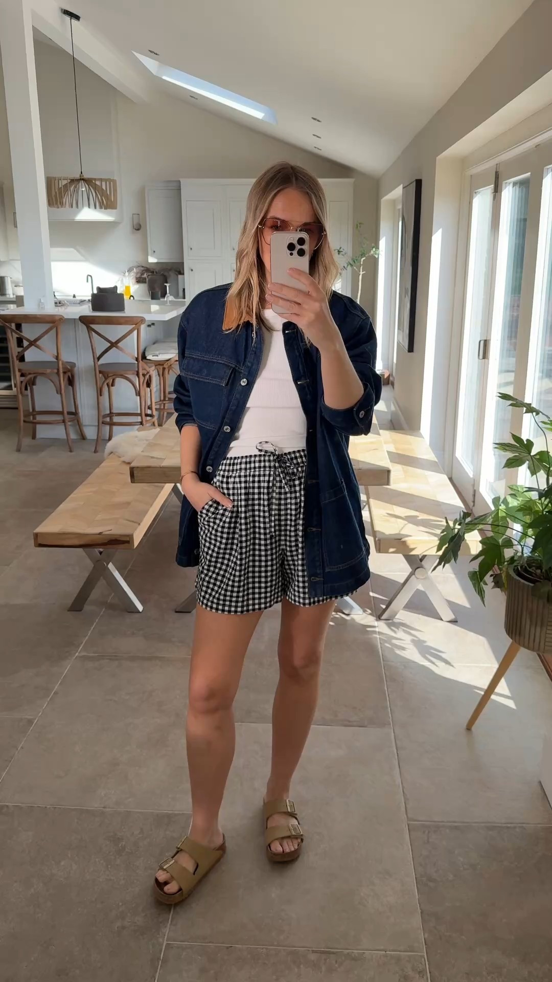 Casual summer shorts outfit. 
Lots of lovely feedback on these flowing gingham shorts , easy care , textured fabric , long enough and pockets - trust me they are brilliant. 
Styled with a simple vest top and a denim jacket (love this one for a ‘cool’ edge ) 
I wear a large in the shorts 
(Generous 14) 
And a medium in the jacket (roomy) 
Large in the vest (fitted) 

Staycation
Shorts outfit 
Denim jacket 
Spring jacket 

#LTKspring #LTKsummer LTKAroundTheWorld