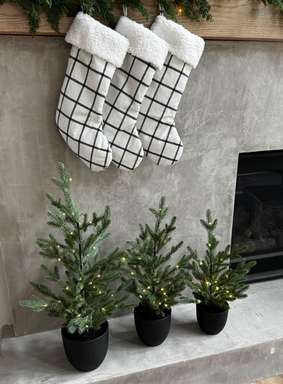 Mini pre lit Christmas tree and plaid black and white stockings 

#LTKHoliday #LTKCyberWeek