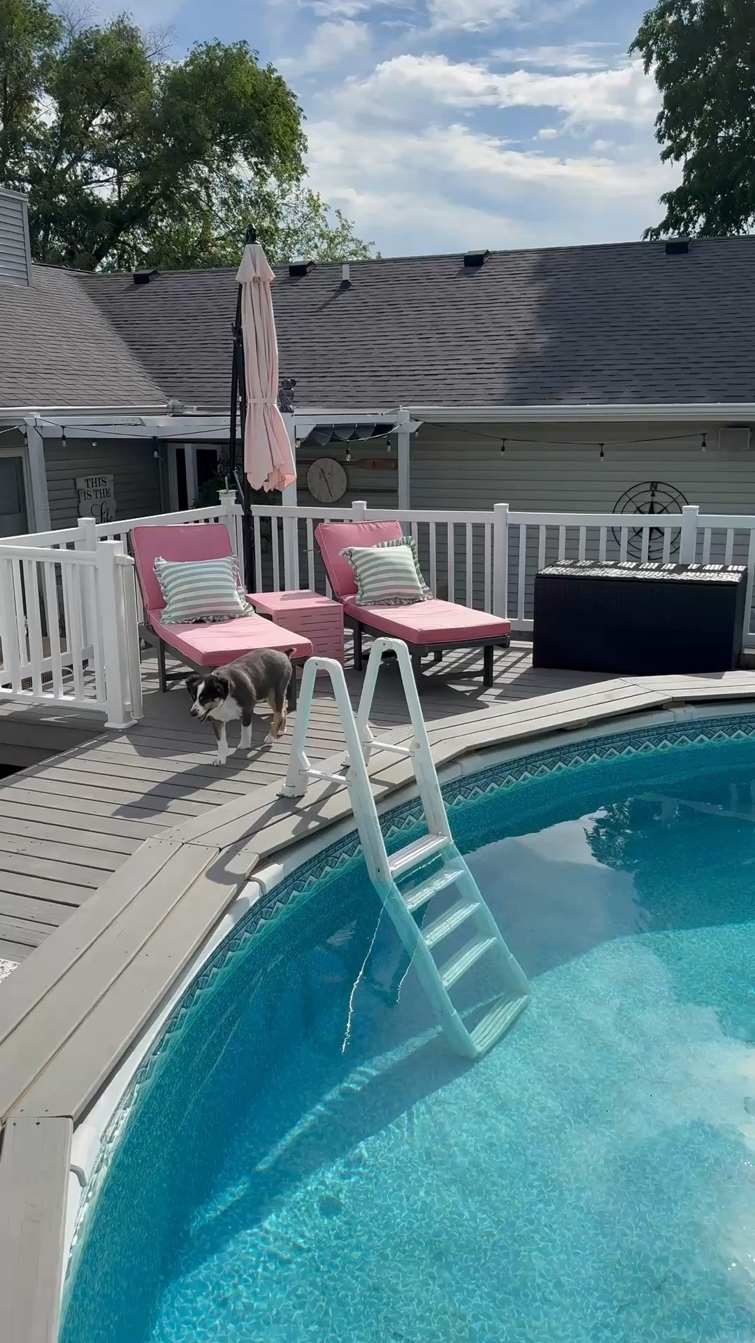 Outdoor deck essentials 
Pink lounge cushions 
Lounge chairs 
Pool umbrella 
Macrame umbrella 
Patio set 
Outside heater