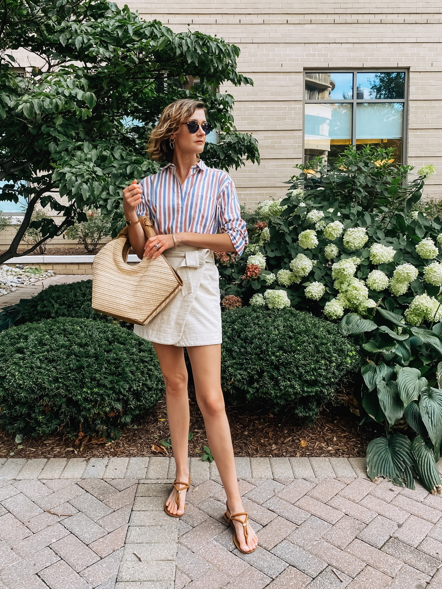 A light linen wrap skirt and oversized striped button down give summer tomato girl vibes. Straw bag is on sale! 

#LTKitbag #LTKSeasonal #LTKsalealert