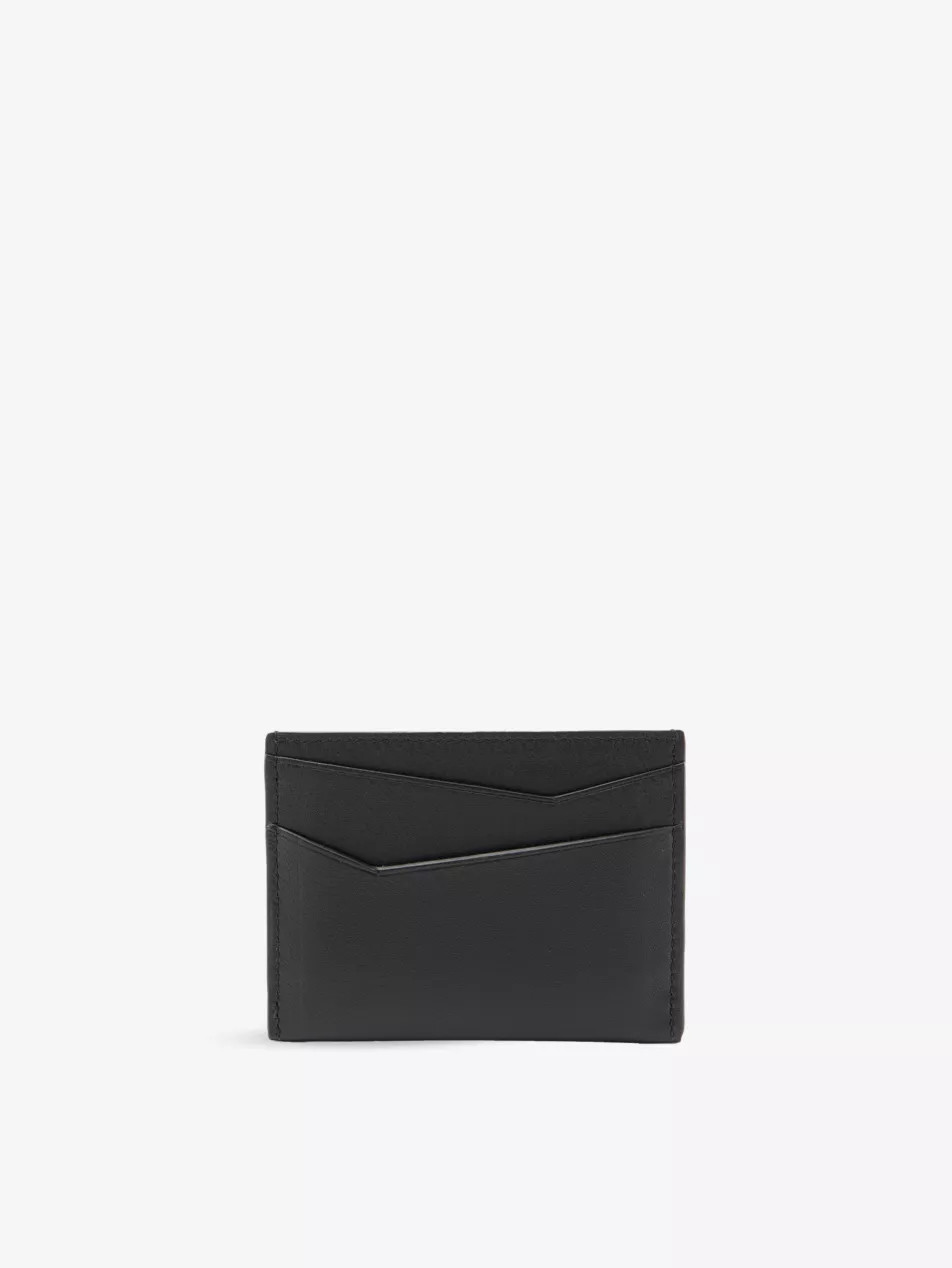 Puzzle Edge brand-debossed leather card holder | Selfridges