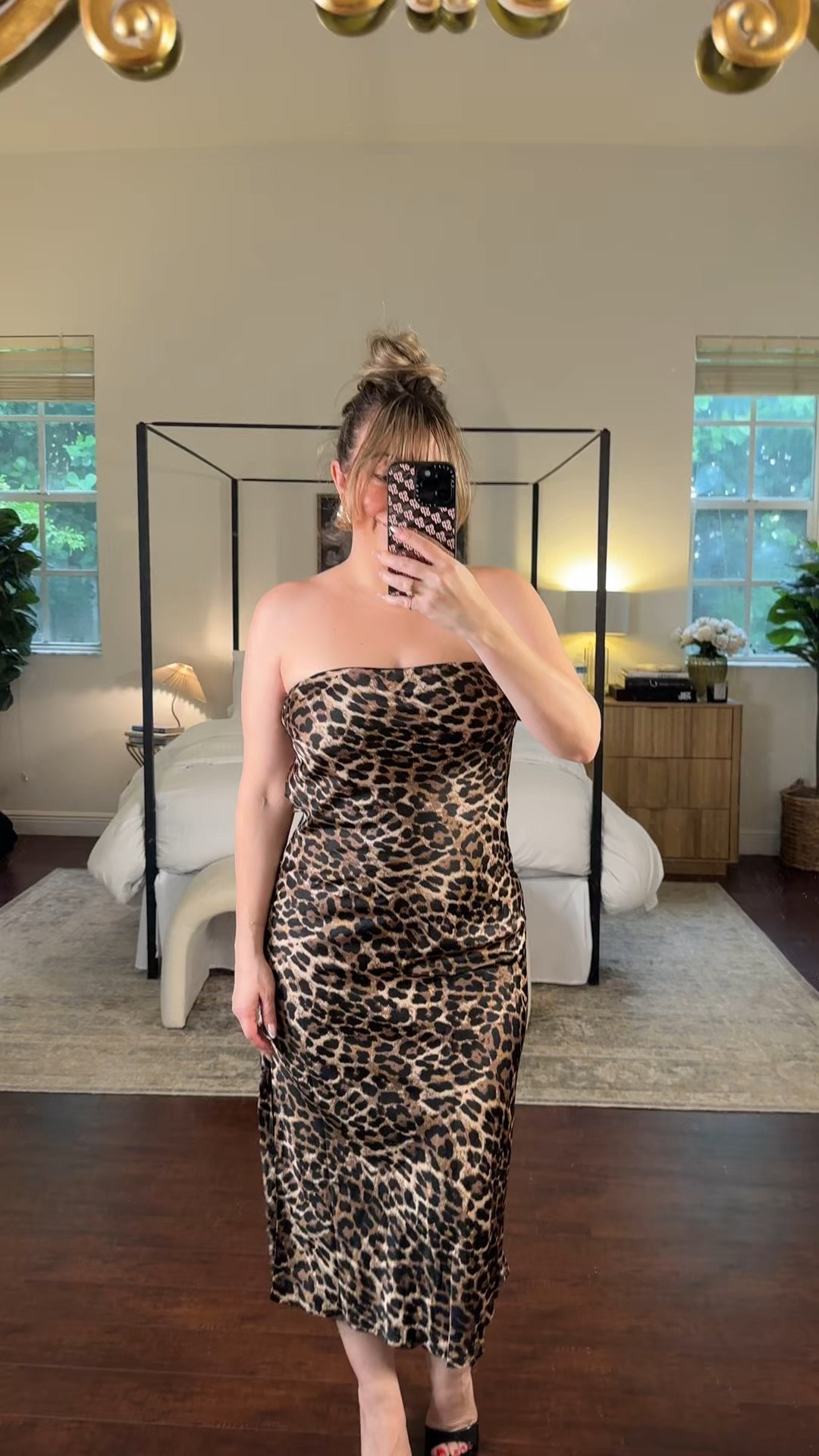 This leopard midi dress is so sleek and chic! Perfect for a cocktail party, night out or wedding guest dress!