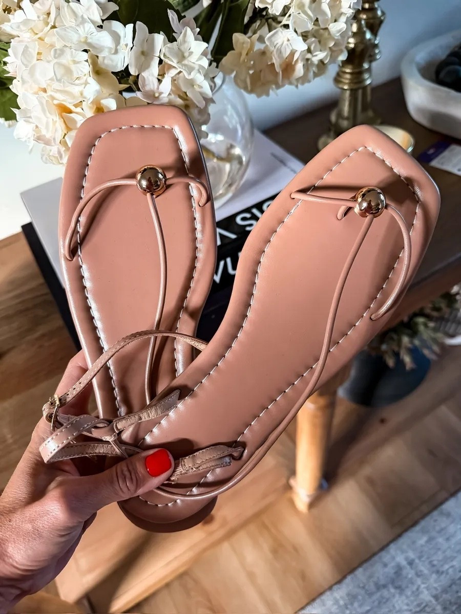These are the kind of strappy sandals that go with everything. The barely there straps keep them elegant, the low profile makes them easy to wear for hours, and they instantly dress up everything from denim to dresses without competing with the outfit.

strappy sandals, neutral sandals, heeled sandals, summer shoes, wedding guest shoes, vacation sandals, dressy sandals, everyday heels, versatile footwear, women’s fashion, TheMomInStyle

#LTKootd #LTKSeasonal #LTKTravel