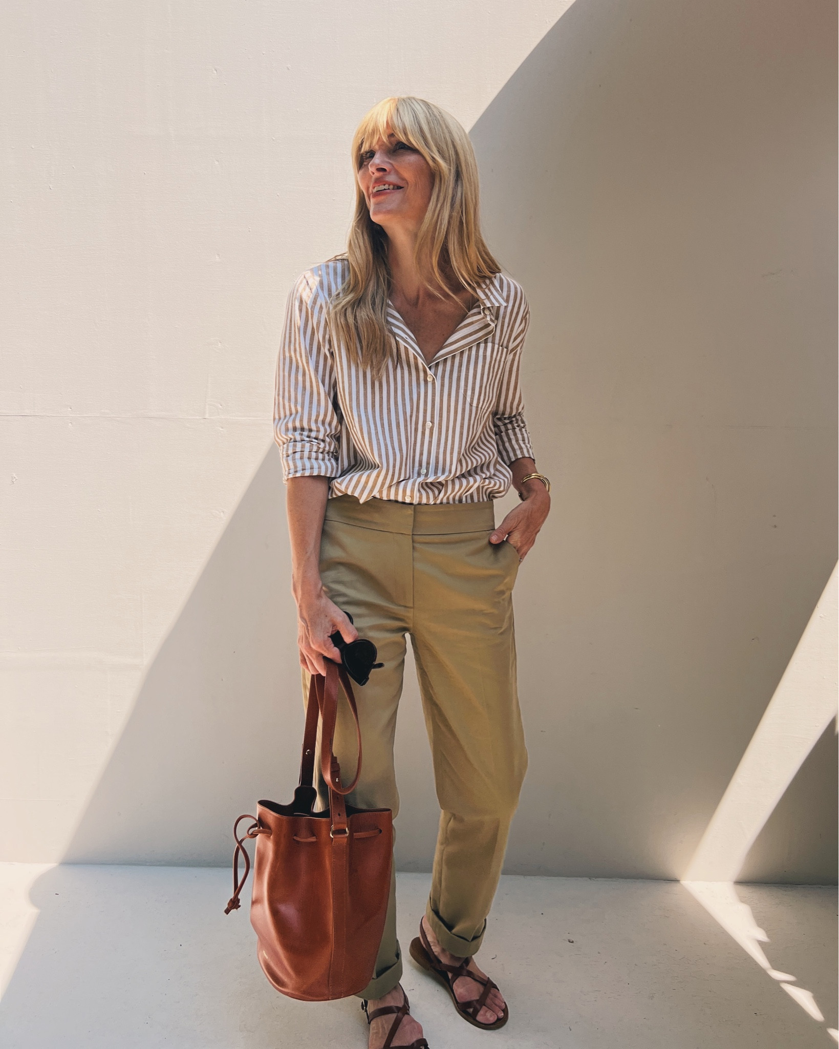 Striped shirt, brown trousers, brown sandals, brown crossbody bag 

#LTKstyletip #LTKSeasonal #LTKeurope