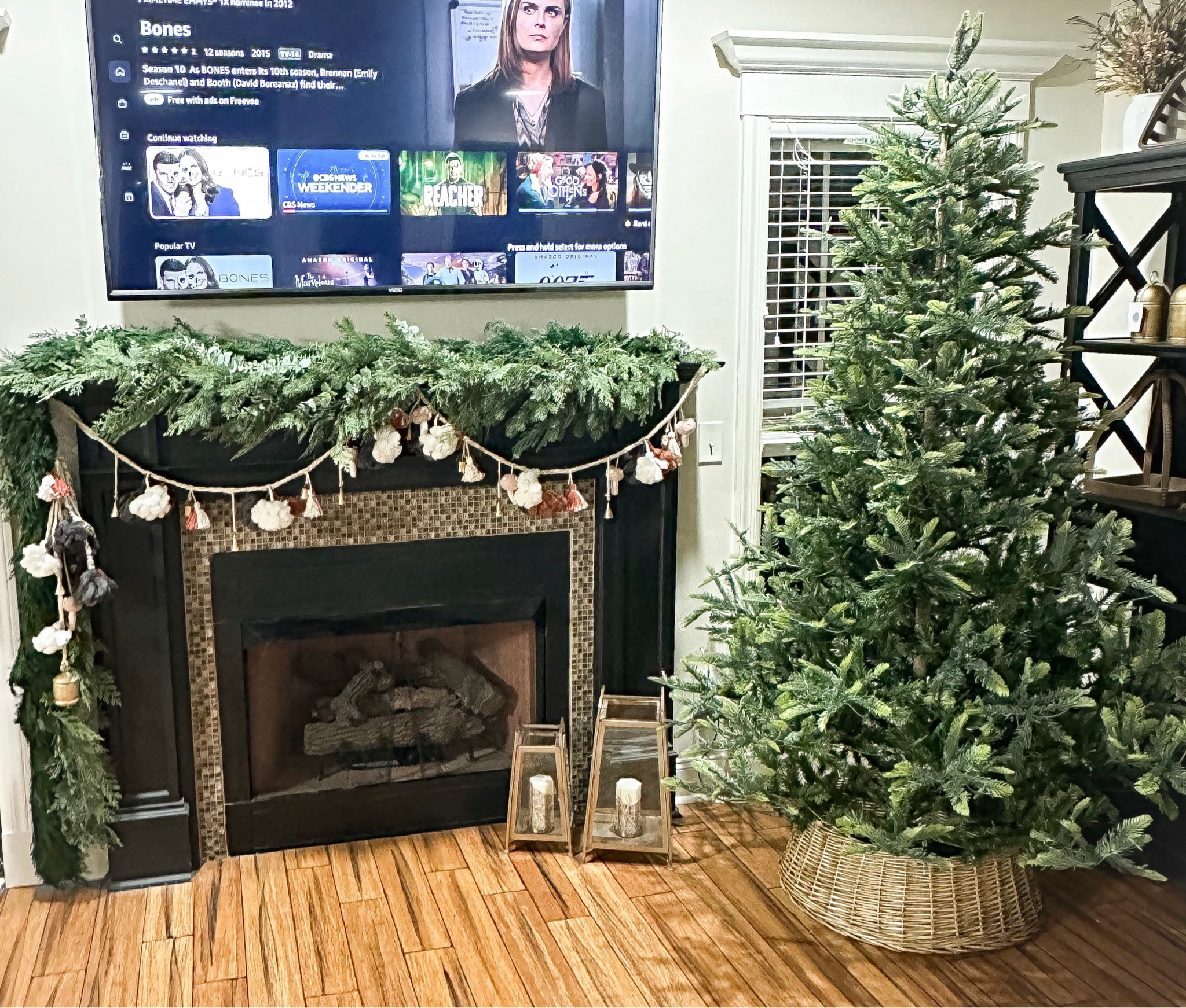 All right, friends! Linking all of my Christmas home finds that are still in stock! I got the Anthropologie boho garland last yet after Christmas for an absolute steal and have used it on my mantle and stairway, and am doing a neutral woodland theme. Obviously, much more to come but sharing the links before all the good stuff sells out. I found a similar boho tassel garland over at Michael’s and you could easily combine with a bell garland for a similar look. I’ll be adding twinkle lights and decorating the tree soon - I was lucky to get several of the flocked ornaments from Target and Homegoods recently so don’t lose hope if they are out of stock - just keep checking. I achieved the mantle swag with two Target faux cedar garlands, one Target Eucalyptus and Pine garland, and one preserved cedar garland on top. The tree is so, so good - 7.5 foot with 700 real soft yellow bulb lights and currently on special at Amazon for $221 with a limited deal (we also got a free Echo Pop and Smartplug with the purchase of the tree with code ALEXATREE, so don’t forget to add at checkout!). Ask all questions and happy shopping! Oh, IMPORTANT: tomorrow starts Anthropologie’s special in-app sale for 30% off clothing, accessories and home so you can grab your adorable holiday goodies then! 🎄 

#LTKCyberWeek #LTKsalealert #LTKHoliday