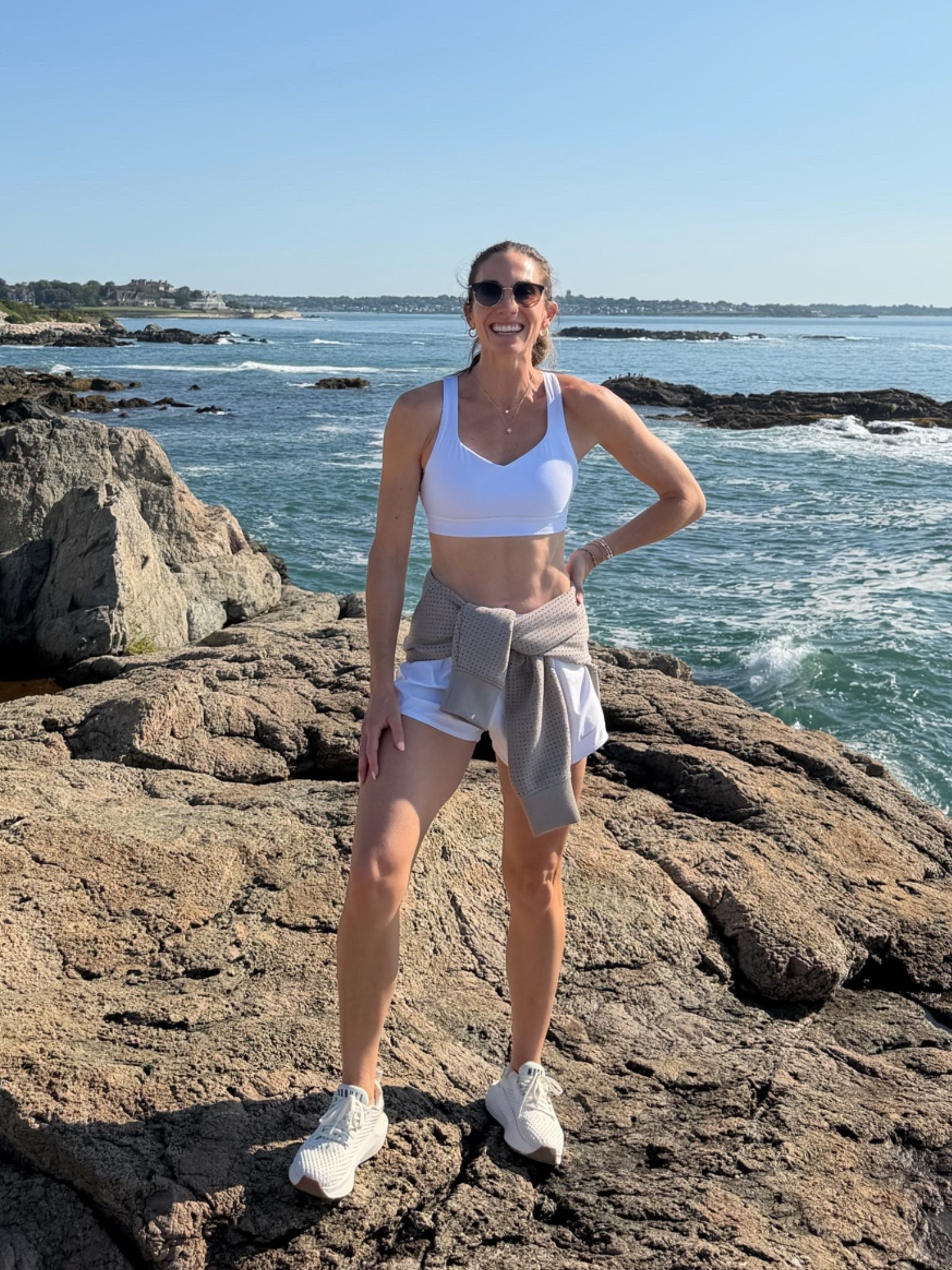 I spent the weekend in Rhode Island and I’m sharing everything I packed and wore. These white running shorts and sports bra paired perfectly with this taupe Calia crewneck sweater. I wore my NoBull walking shoes and was comfy for a 9 mile hike on the water! ￼