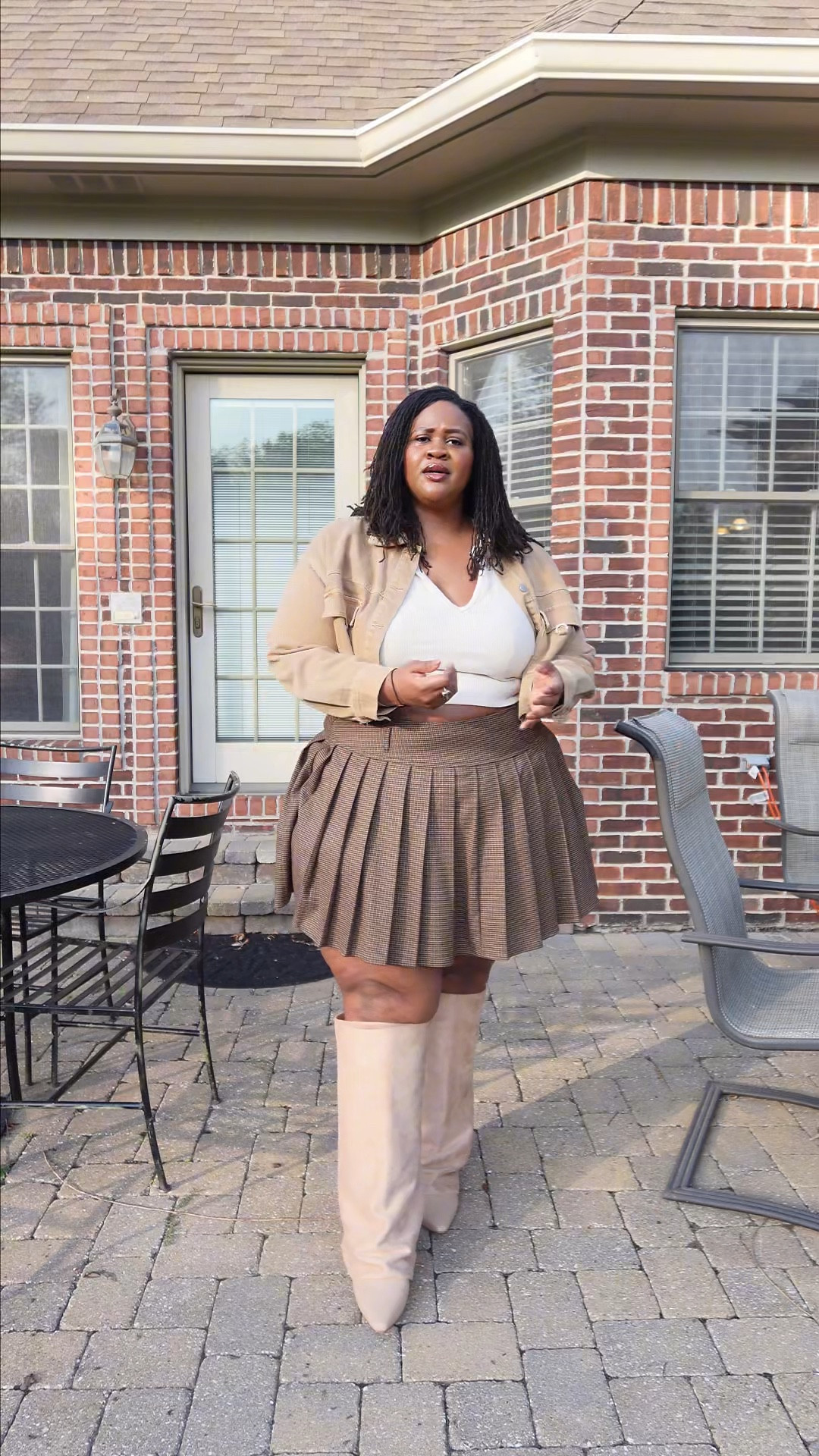 Had to repost this fit!!! I’m so obsessed with the colors, the boots, the pleats. It’s such a balanced outfit. 

I’m wearing a size 24 in the skirt and a size 12 in the boots. I’ve linked to alternatives of the crop top and denim jacket. 

#LTKPlusSize #LTKShoeCrush