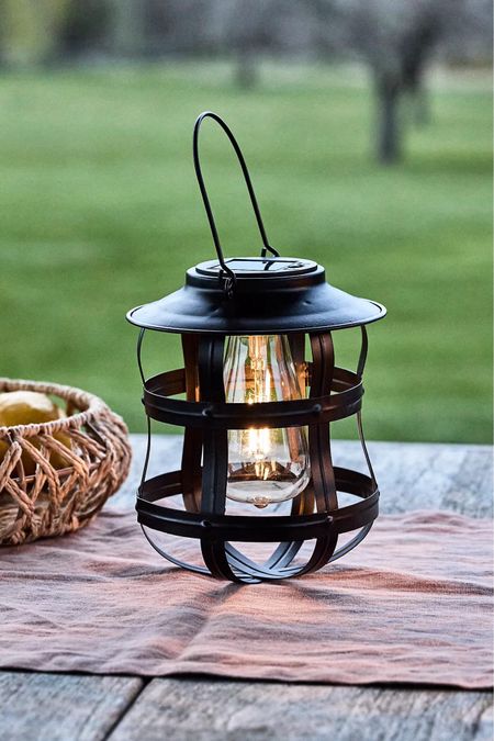 Illuminate your space with this chic solar lantern, designed to cast a warm white glow. Featuring a sleek, modern caged exterior, this lantern is powered by the sun, offering an eco-friendly lighting solution. Made with durable metal and a glass bulb, it has an approximate lifespan of 6 hours with a fully charged solar battery. Perfect for both indoor and outdoor use, this lantern effortlessly combines style and functionality to enhance your home decor.

#LTKHome #LTKParties #LTKSeasonal