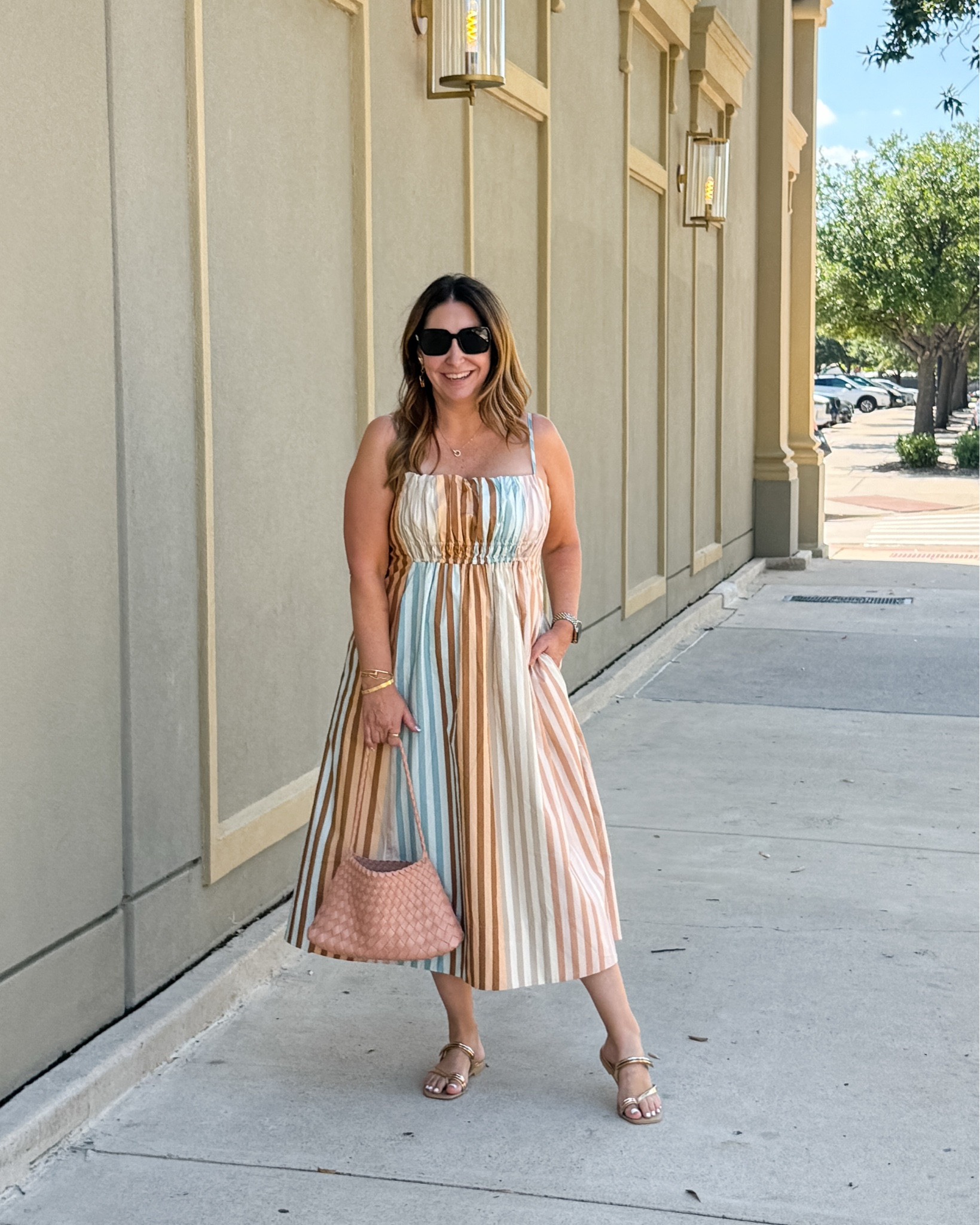 This striped maxi has been perfection all trip ☀️ The soft pastel stripes feel fun and beachy, but it's casual enough for daytime and dressy enough for dinners out. I styled it with a woven bag, gold sandals, and stacked bangles for that easy, sun-kissed summer look — and yes, it has pockets!
📏 Wearing tts, L

#LTKSeasonal #LTKMidsize #LTKTravel