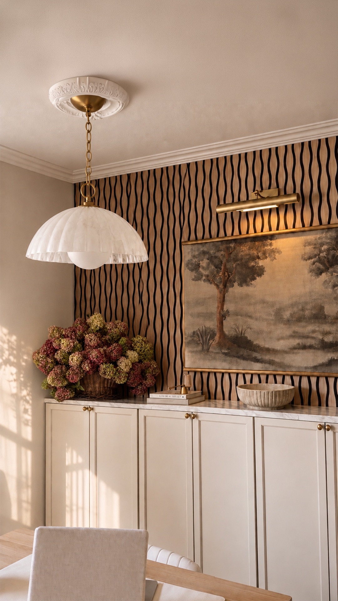 The light that completely transformed this space ✨🤎 I love finding pieces that feel timeless, elevated, and a little vintage-inspired, and this Regina Andrew Dariel pendant is exactly that. The swirled glass dome paired with the natural brass detailing gives off the dreamiest warm glow and adds so much character without overwhelming the room.
It’s one of those finishing details that makes the entire space feel more intentional and expensive. Linking this beauty + more of my favorite lighting finds here on LTK! 🔗✨

#LTKHome #LTKSeasonal