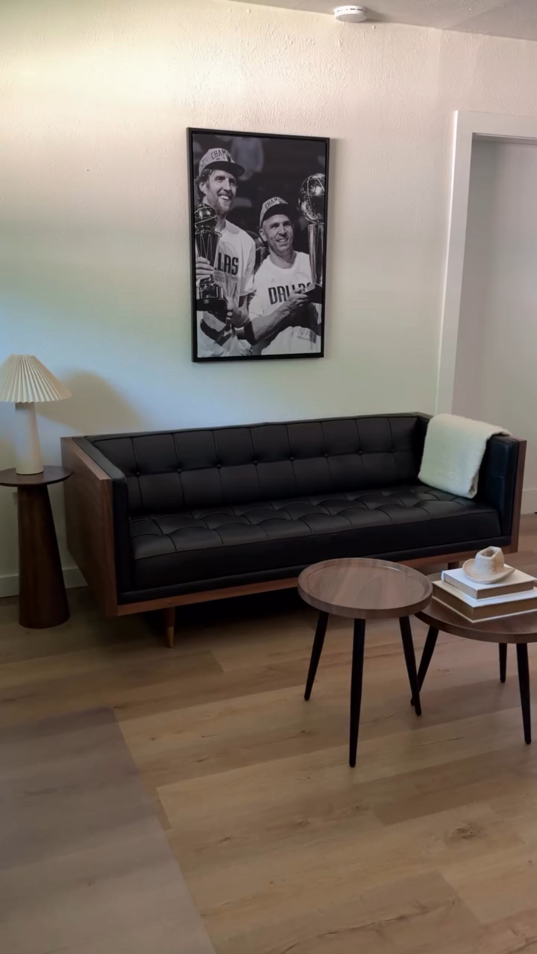 Office sofa of our dreams 🤌🏼 @manhattan.home.design killed it with this mid century modern piece. Stunning yet functional! Hunter works from home so this was the perfect addition to complete his office. 

Comment SHOP and I’ll send you a DM with more pieces from #manhattanhomedesign 🖤 
—

Home office, work from home, office sofa, mid century modern style, leather sofa, home office furniture, home office style, home office styling