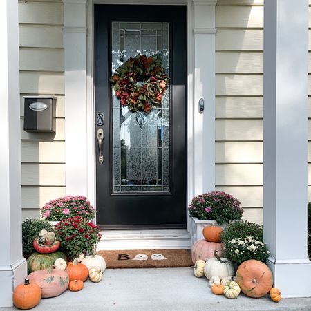 Fall front porch, Halloween doormat, planters, fall wreath 

#LTKfindsunder100 #LTKSeasonal #LTKhome
