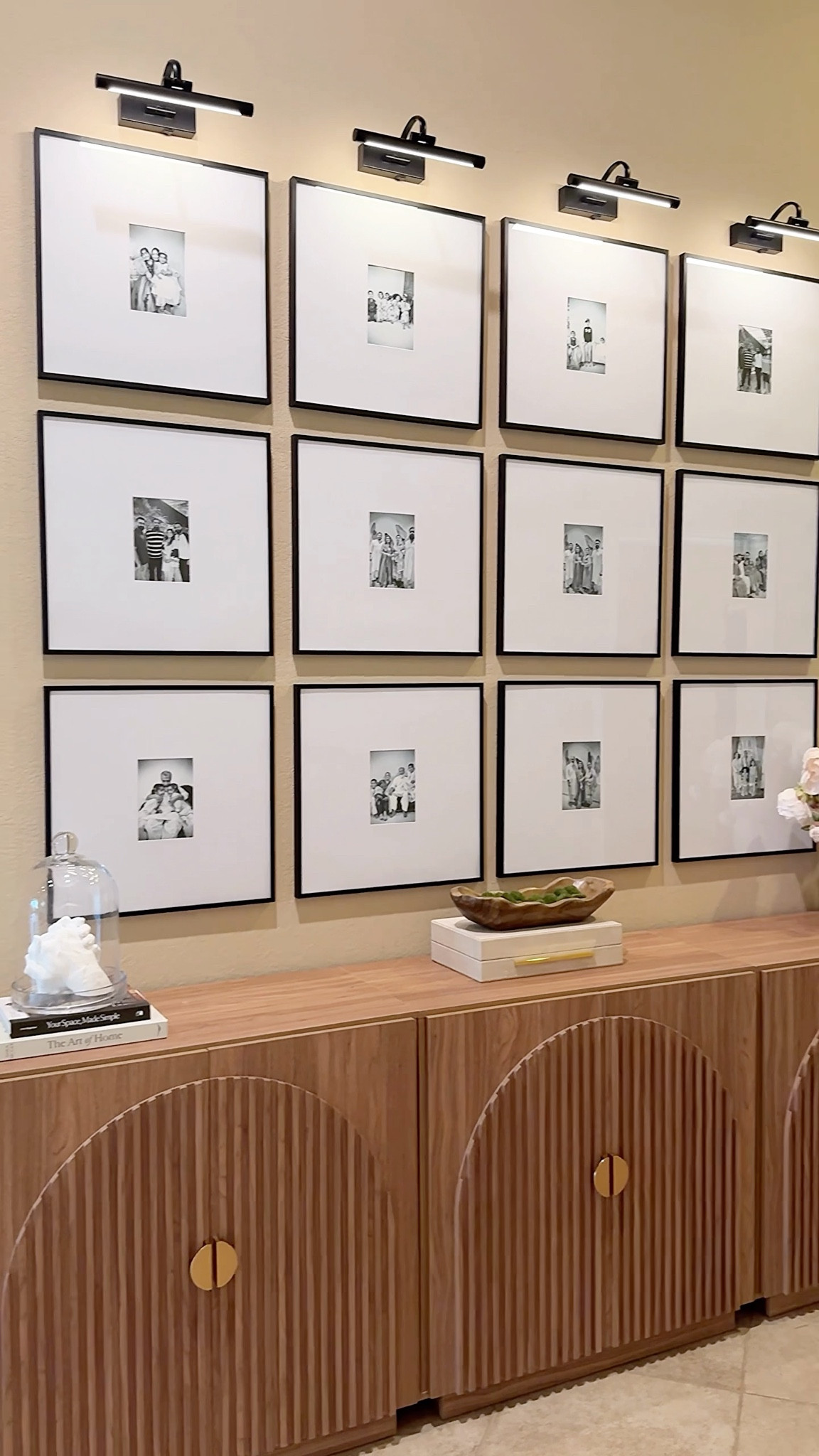 For years, I dreamed of designing a gallery wall that would make our house feel more like home, a space filled with family memories, intentional design, and timeless style.

I’ve tried different gallery wall layouts before, but none of them felt quite right… until now.

This setup features:
✔️ Equal-sized black gallery frames for a clean, modern look
✔️ Battery-operated picture lights to add warmth and drama
✔️ A fluted arch cabinet with soft-close doors that grounds the entire wall beautifully

Whether you’re planning a hallway photo wall, a living room gallery feature, or updating your family photo display—this design brings heart and home together in the most beautiful way.

💬 Would you add a gallery wall like this to your space?

#GalleryWallIdeas #FamilyPhotoWall #HomeDecorInspo #BatteryPictureLights #GalleryFrameLayout #LivingRoomDecor #HomeStylingTips #ModernGalleryWall #NeutralHomeStyle #InteriorDecoratingIdeas 

@walmart 
@wayfair
@amazon 

#LTKSaleAlert #LTKSeasonal #LTKHome