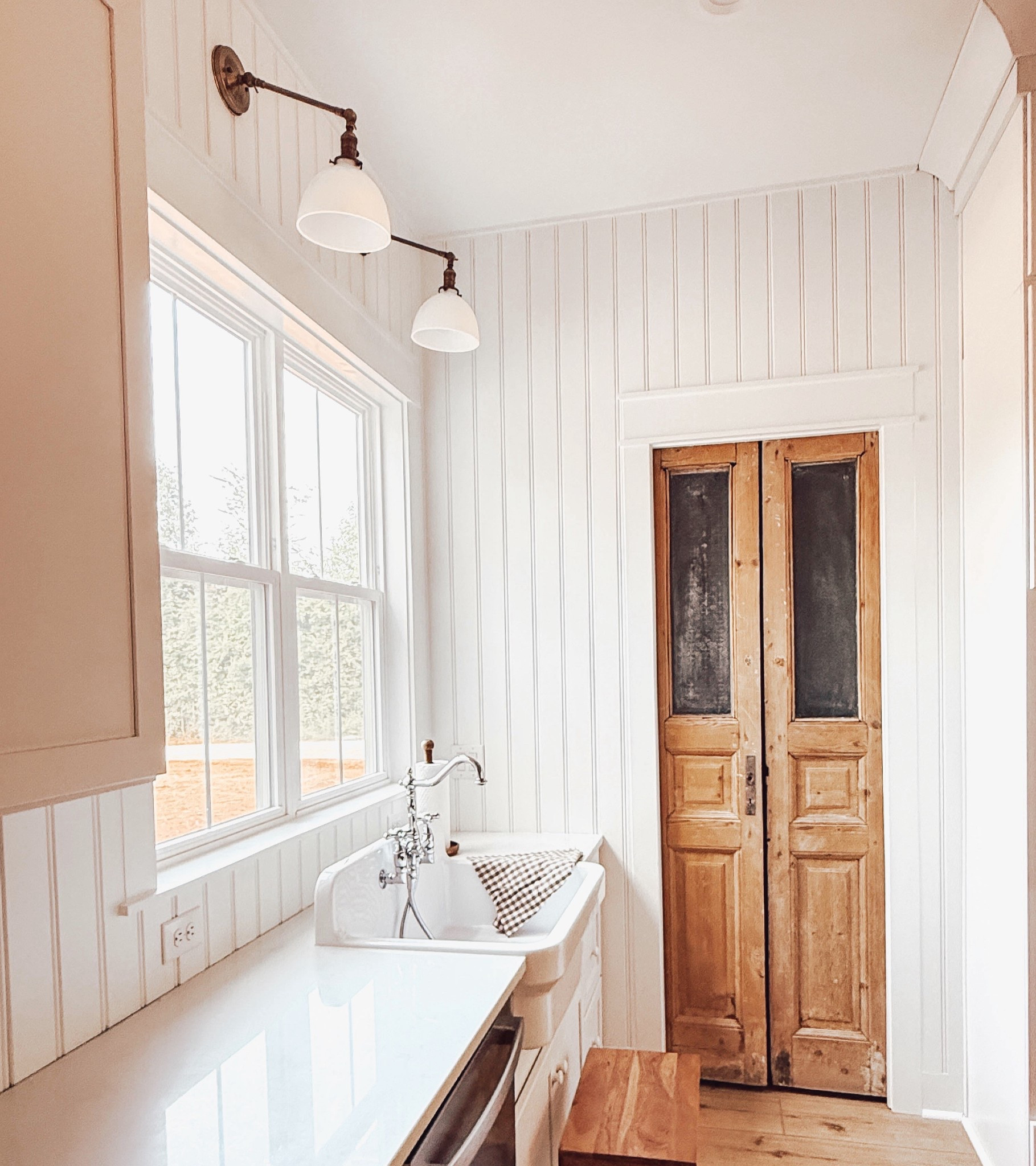 Cottage kitchen, featuring vintage pantry doors, sink, faucet, and lighting. #vintagesink #vintagelighting #kitchenlighting #farmhousesink #oldebricklighting #cottagekitchen #vintagekitchenfaucet 

#LTKHome